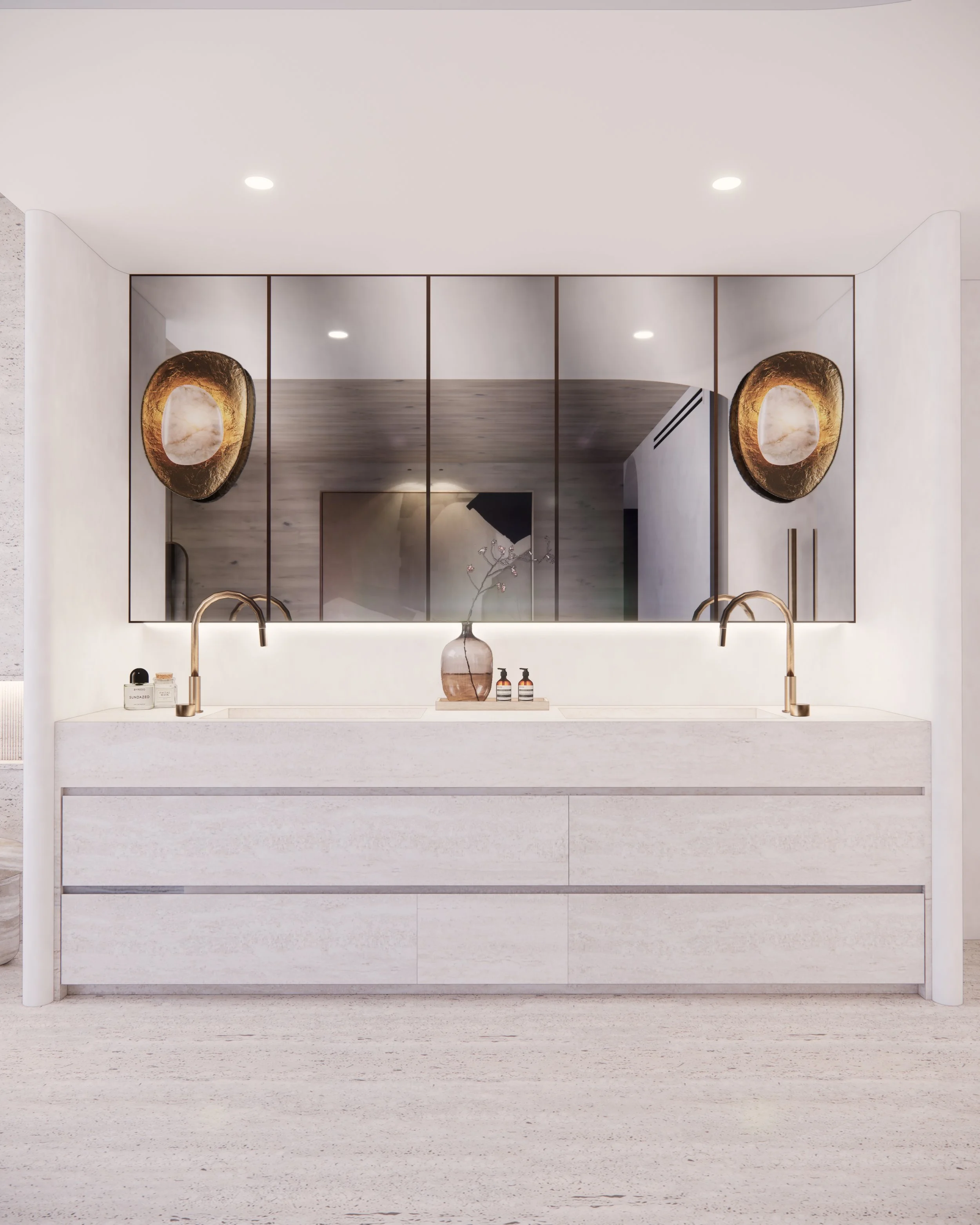 Sculptural double vanity in bold veined marble with curved detailing and brass tapware