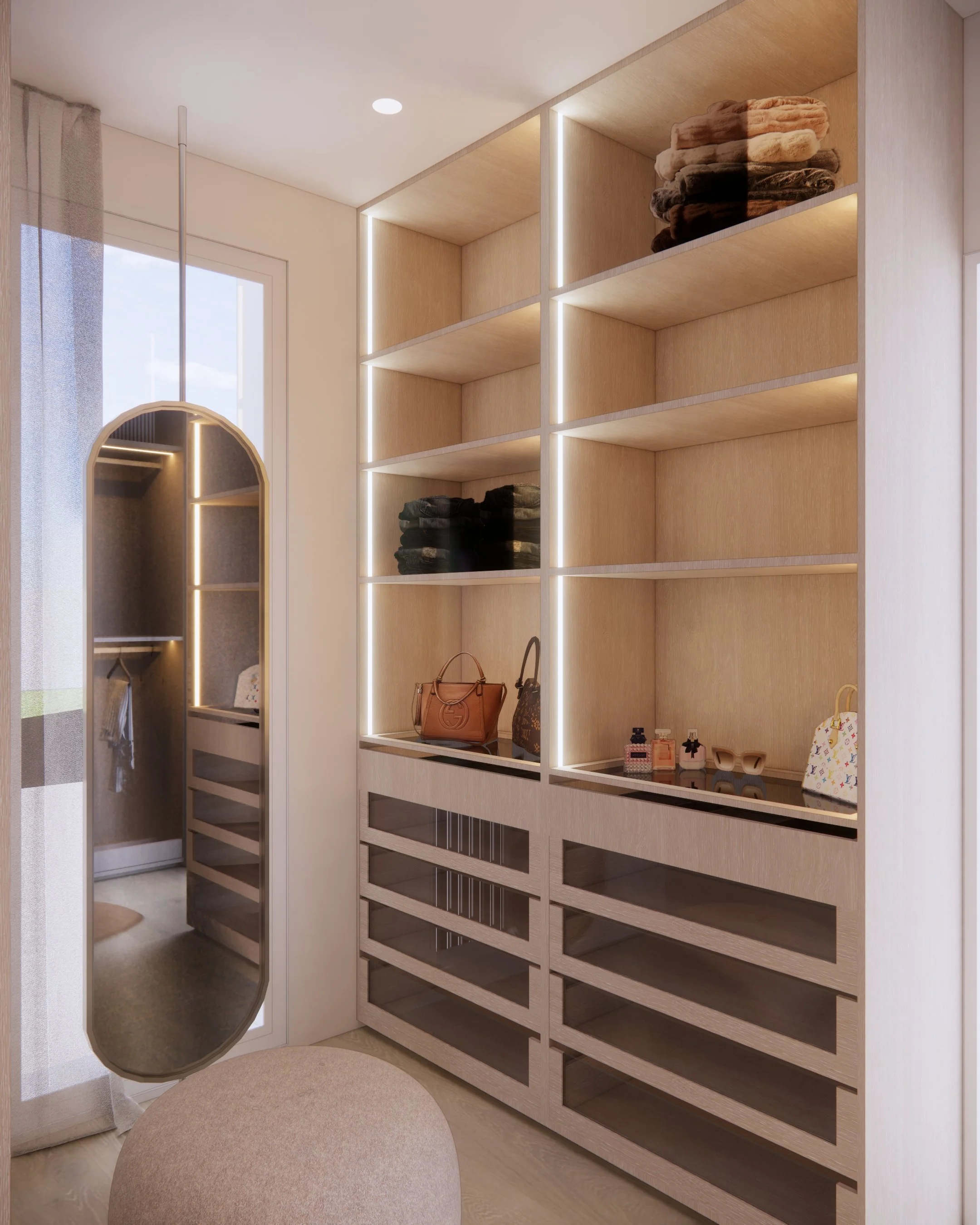 Contemporary built-in WiR with full-height mirror, soft timber joinery, and sculptural pouf seating in a minimal-luxe Melbourne home.