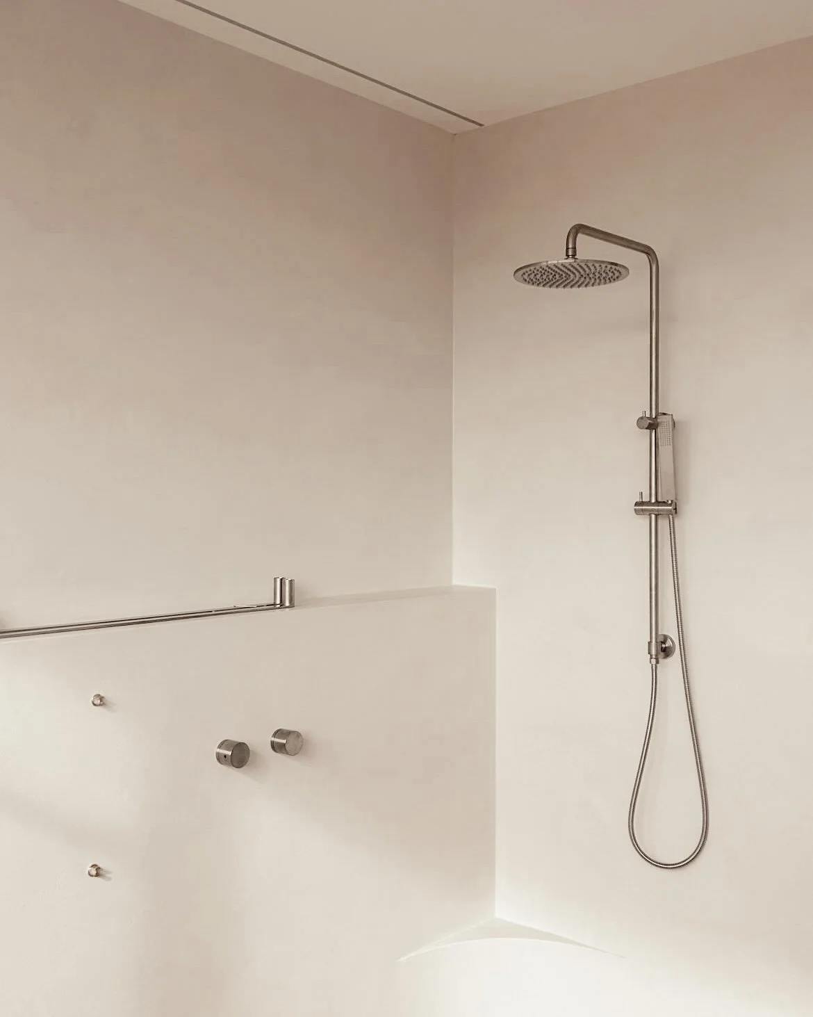 A serene, modern bathroom with marble surfaces and soft timber detailing, part of TID Studio’s Sydney renovation