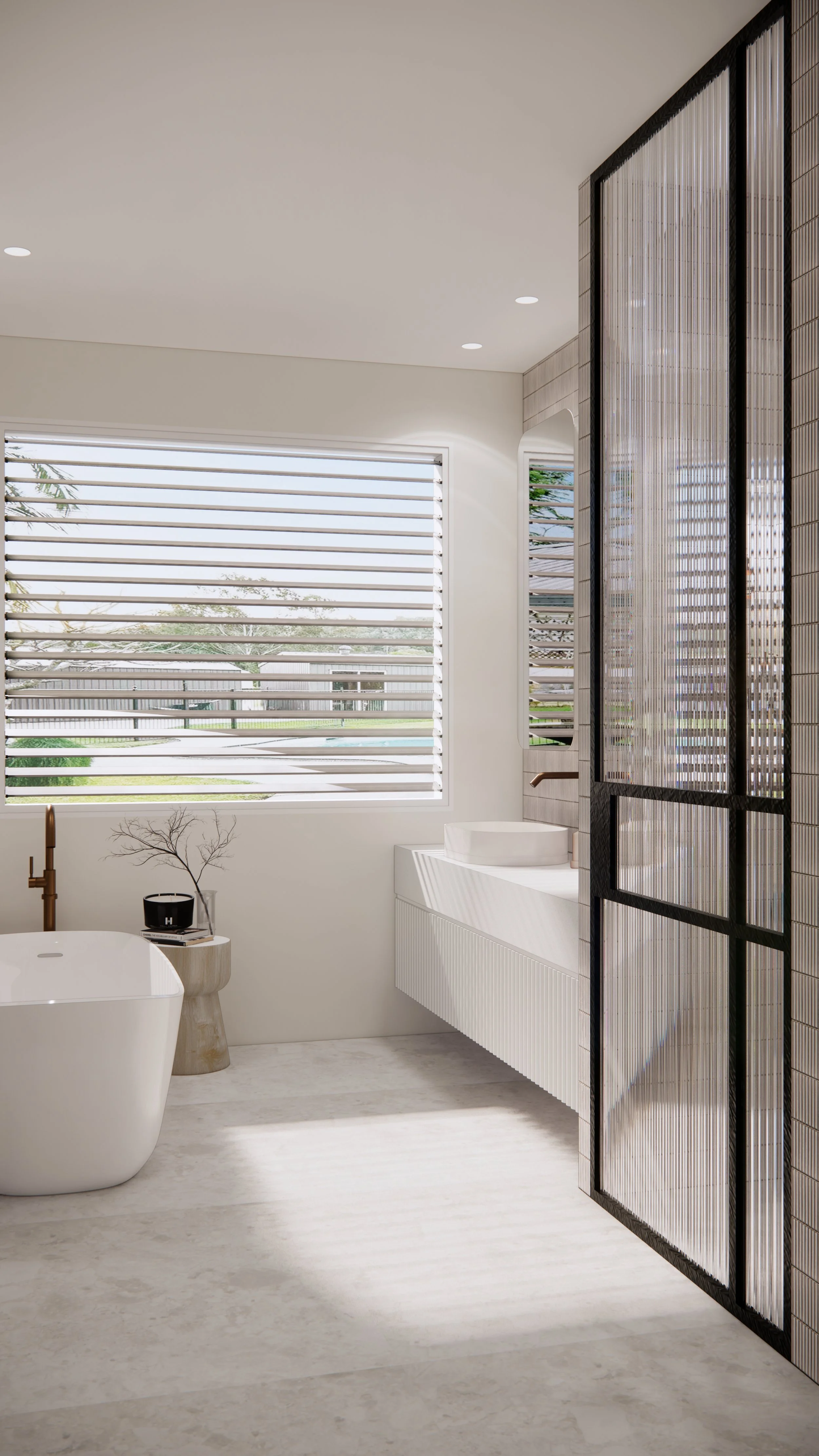 Freestanding bathtub beside louvred window in light and airy coastal bathroom design