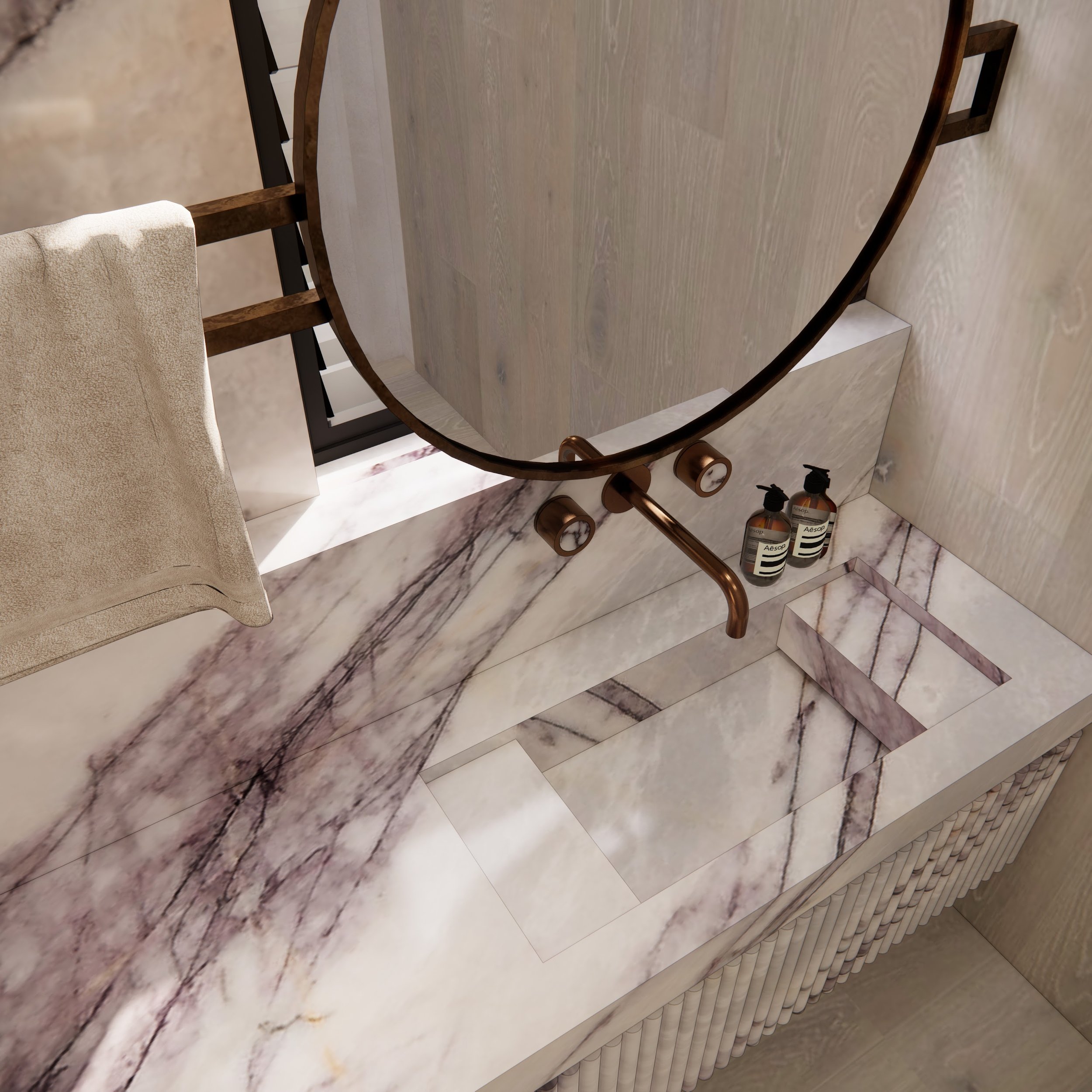 Bathroom vanity in Calacatta Viola marble with brass details