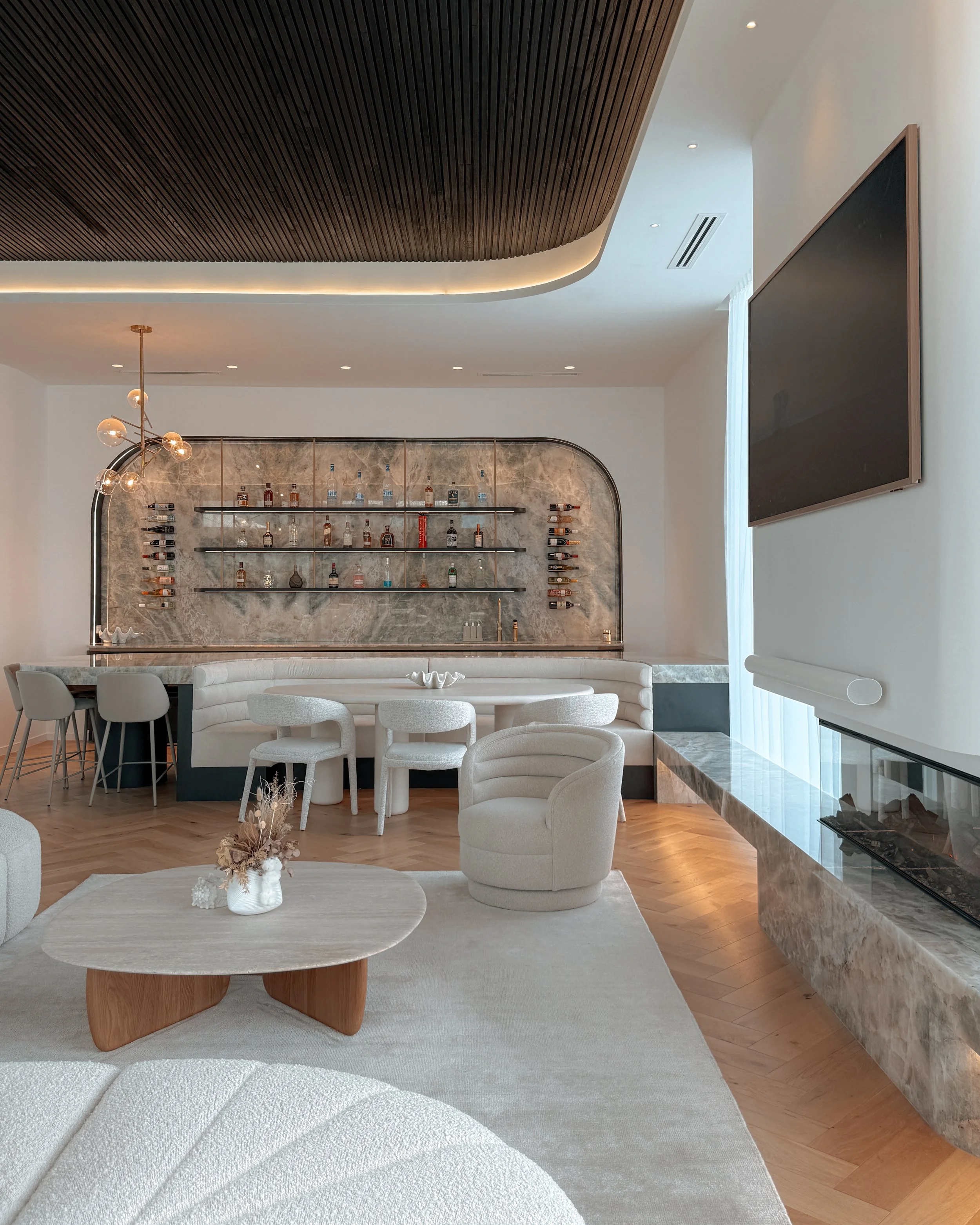 Modern coastal bar with island booth seating in a pool house in Brisbane, designed by TID Studio Sydney
