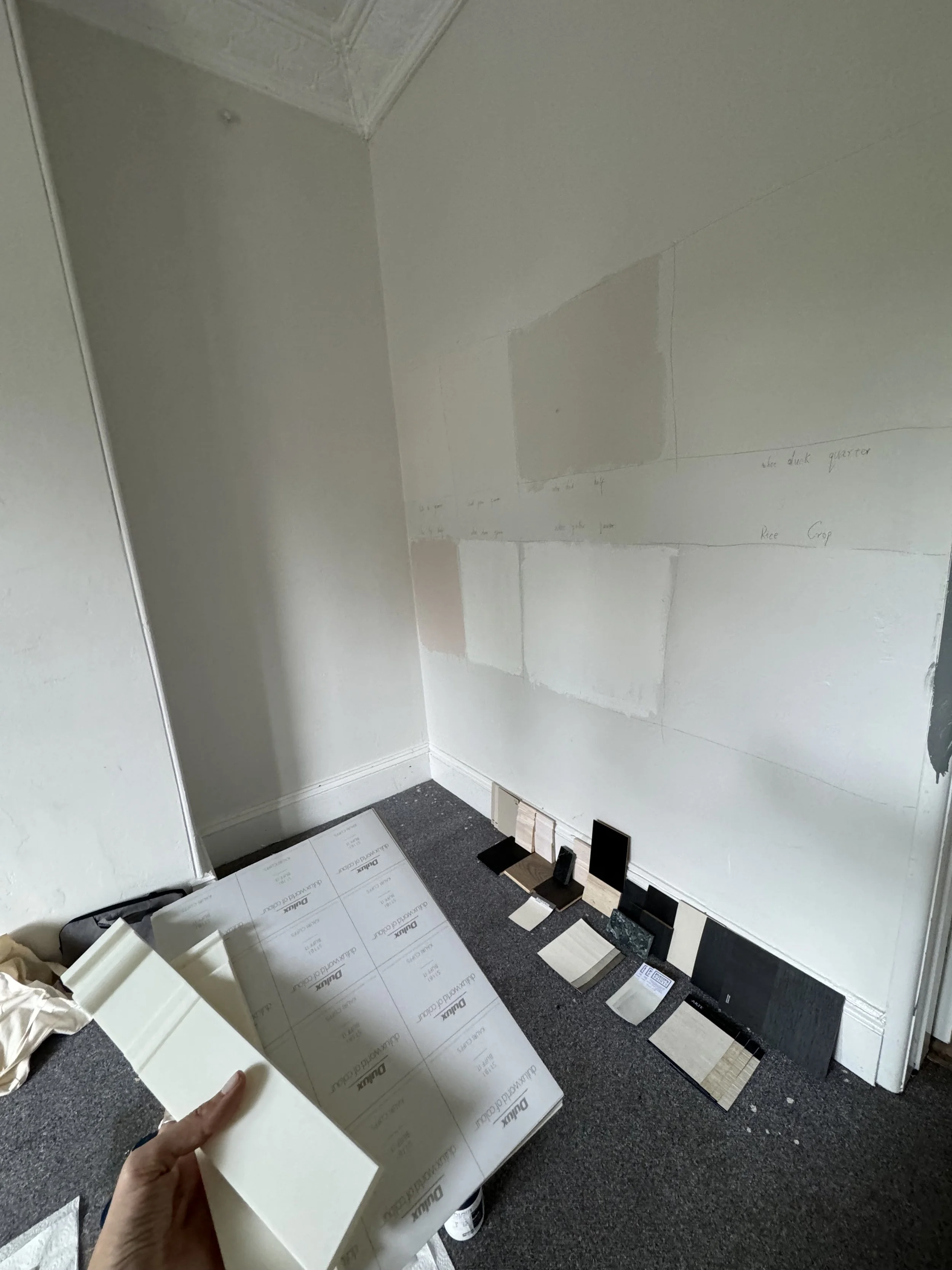 Living room with curved sofa and stone fireplace blending heritage details and modern design - site visit
