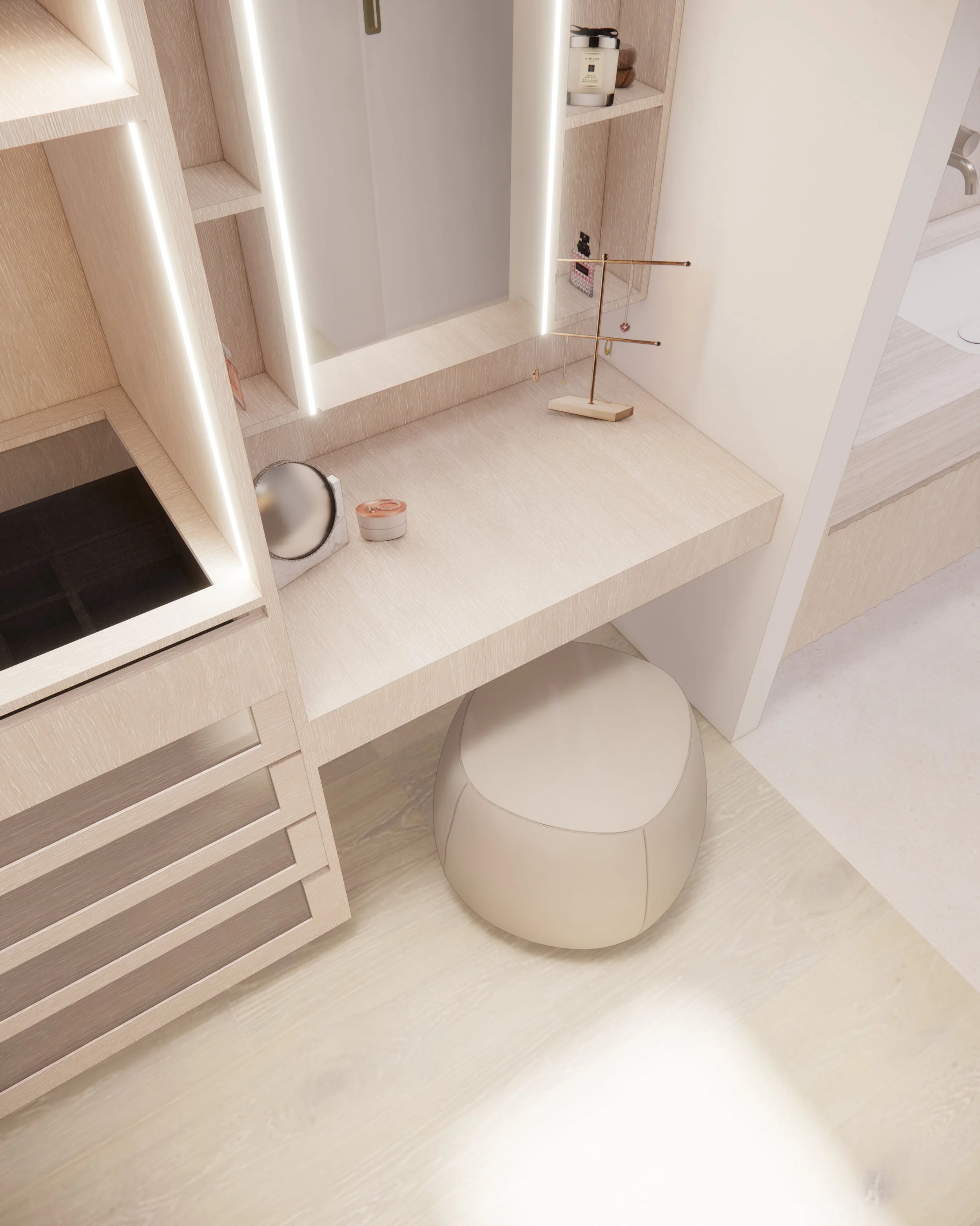 Minimal built-in makeup vanity in a WiR with illuminated mirror, soft timber joinery, and sculptural pouf seating.