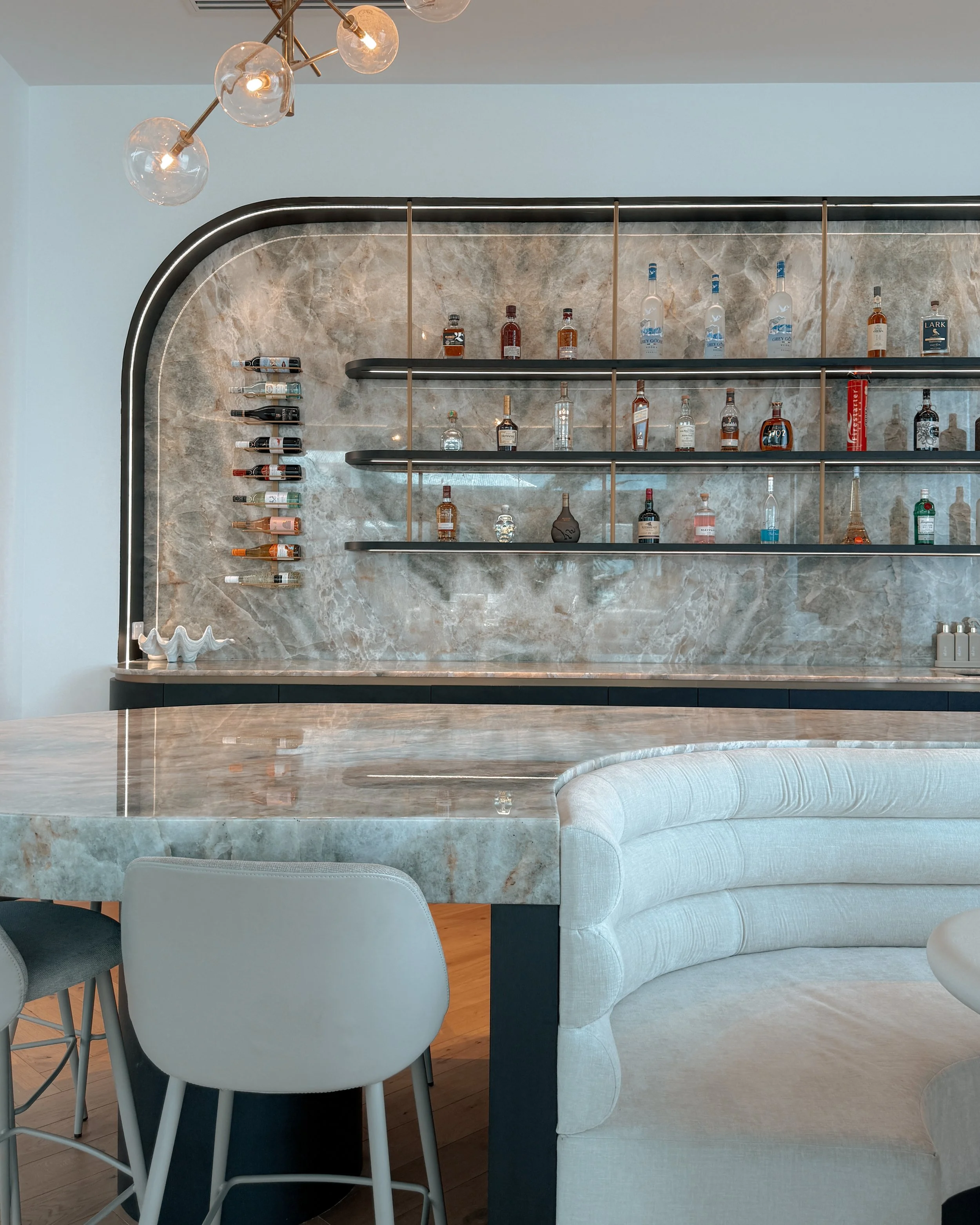 Modern coastal bar with island booth seating in a pool house in Brisbane, designed by TID Studio Sydney