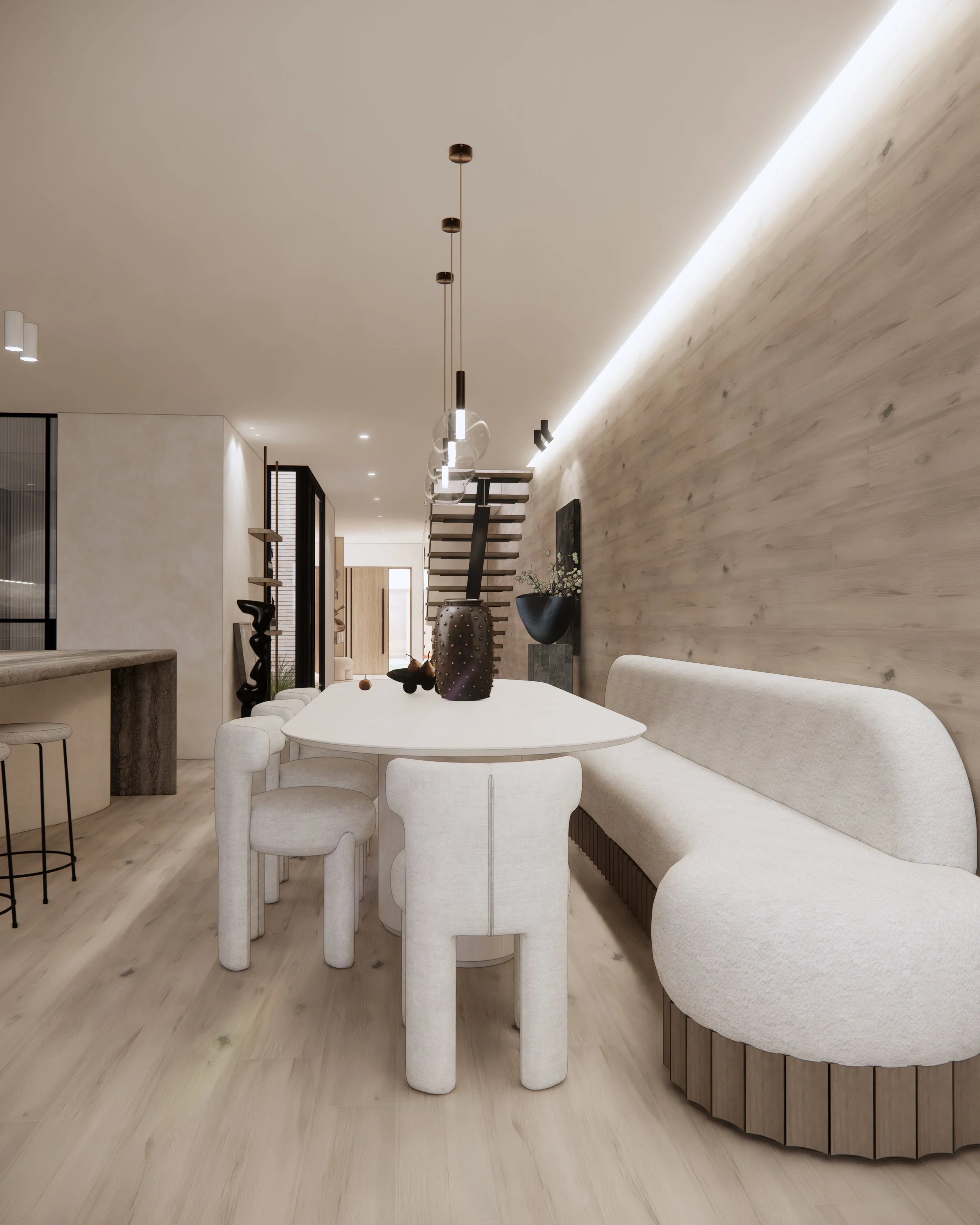 Stone dining table with neutral upholstered chairs, banquette seating and contemporary brass pendant