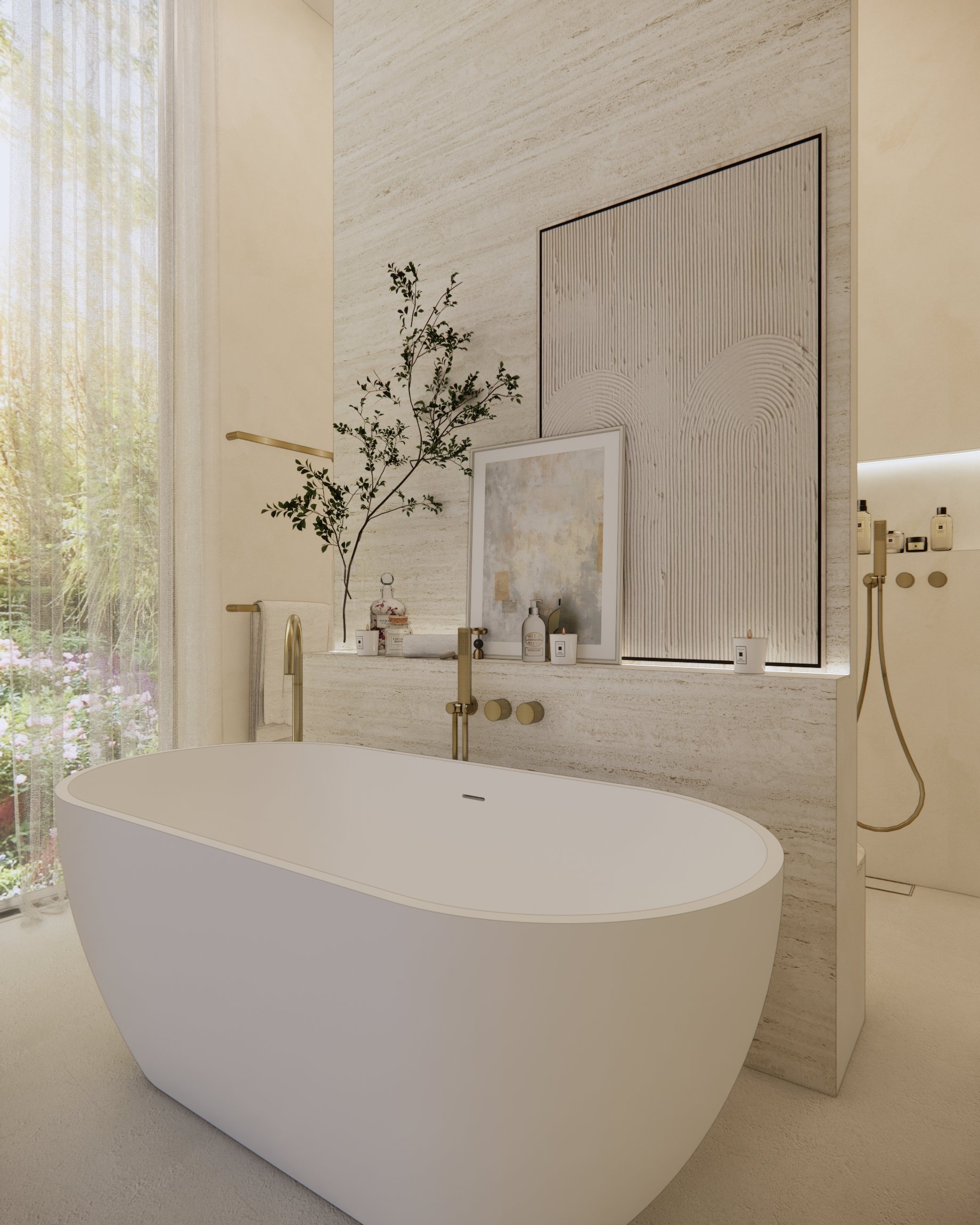 Neutral coastal ensuite with freestanding bath, travertine feature ledge, soft render walls and brushed brass tapware