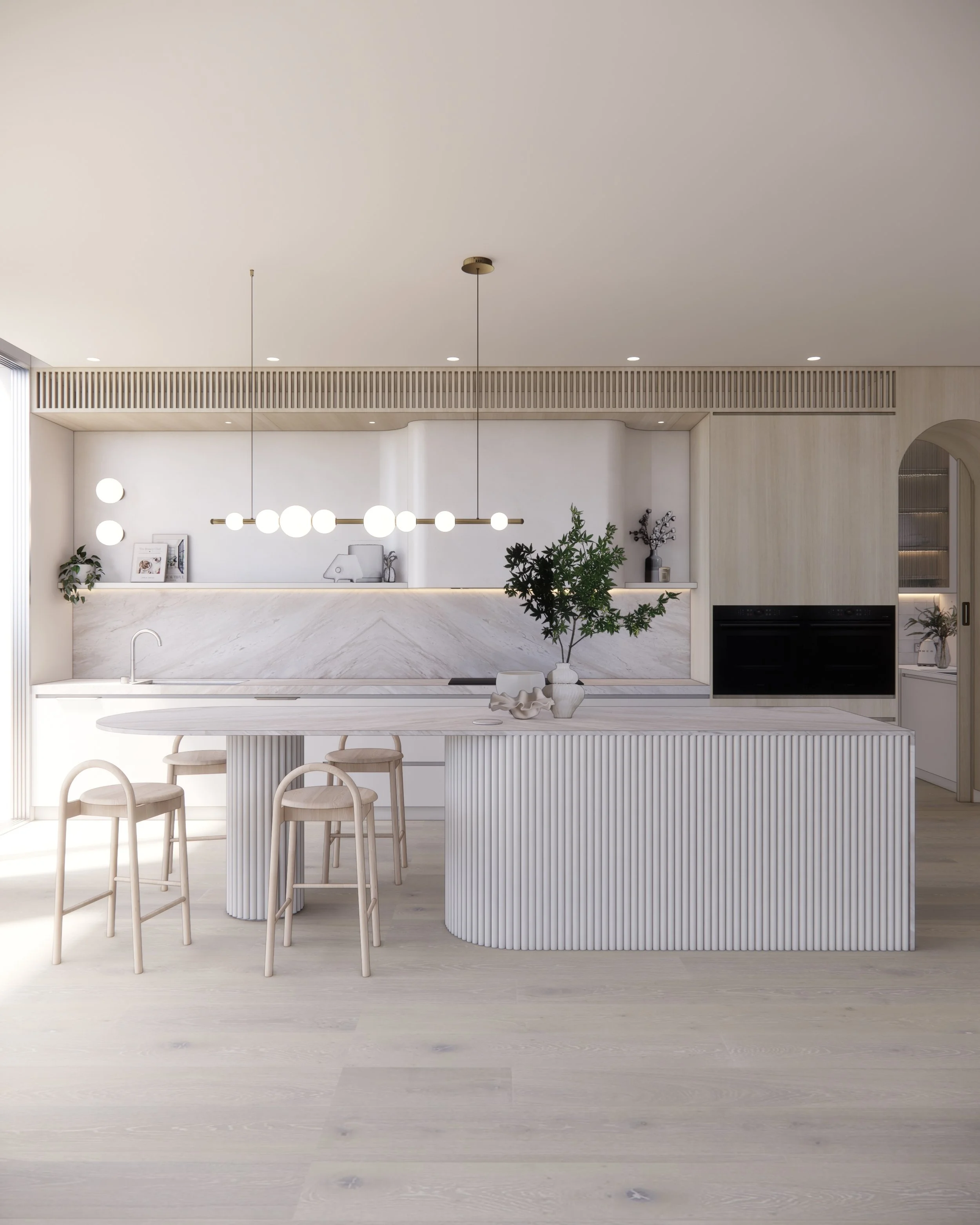 Contemporary soft-curved kitchen with fluted island, light timber cabinetry, and sculptural rangehood in a minimal-luxe Melbourne home.