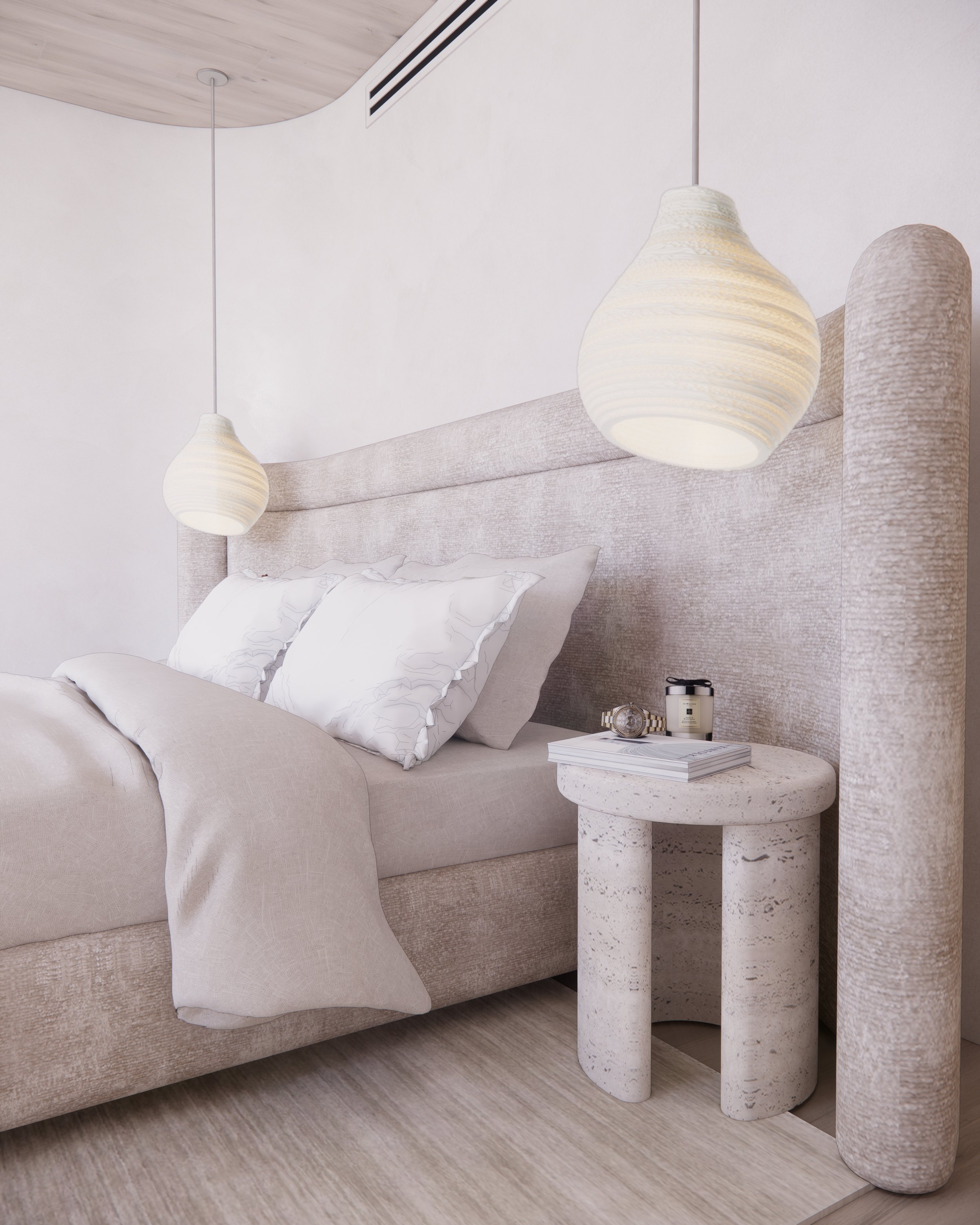 Neutral primary bedroom with textured upholstered bed, sculptural stone side table, and organic lighting