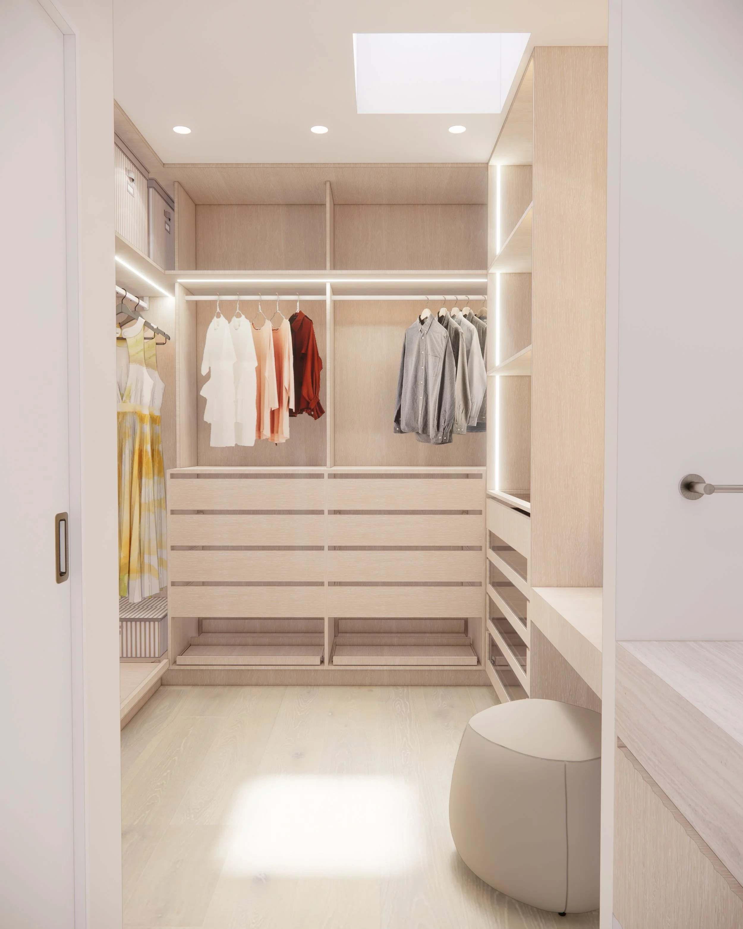 Minimal built-in makeup vanity in a WiR with illuminated mirror, soft timber joinery, and sculptural pouf seating.