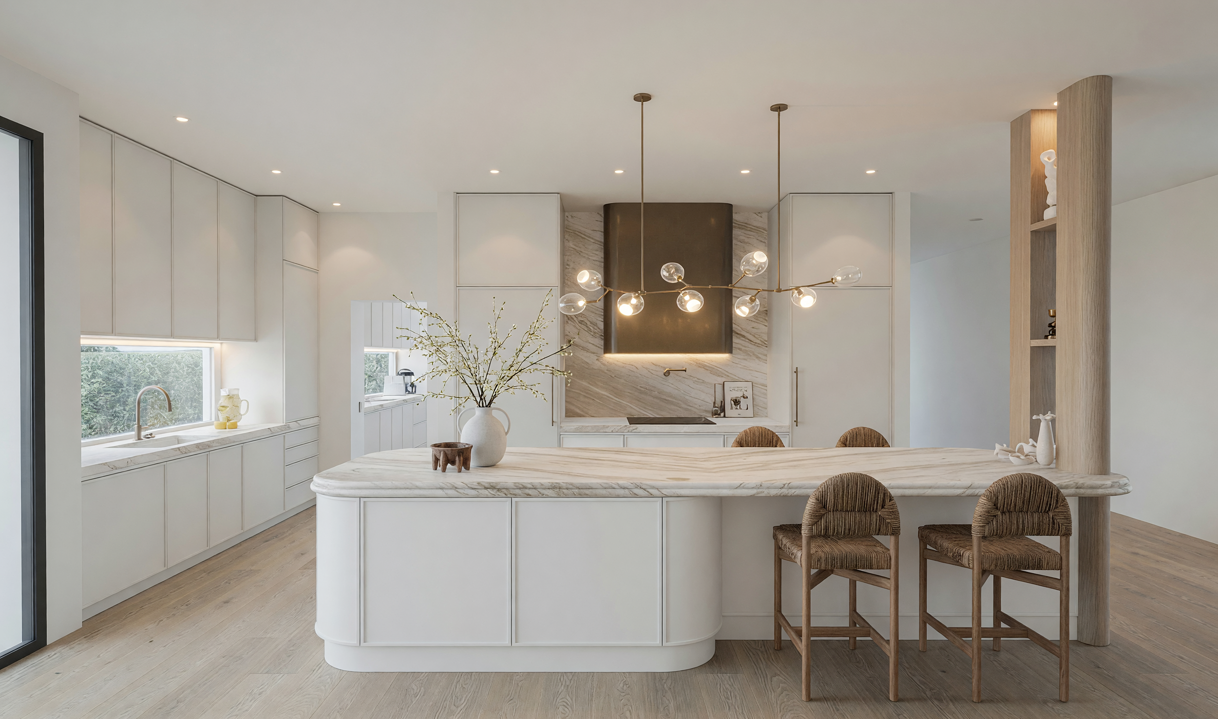 Modern luxury kitchen featuring Taj Mahal stone curved island, warm oak cabinetry, bronze rangehood and custom pantry design