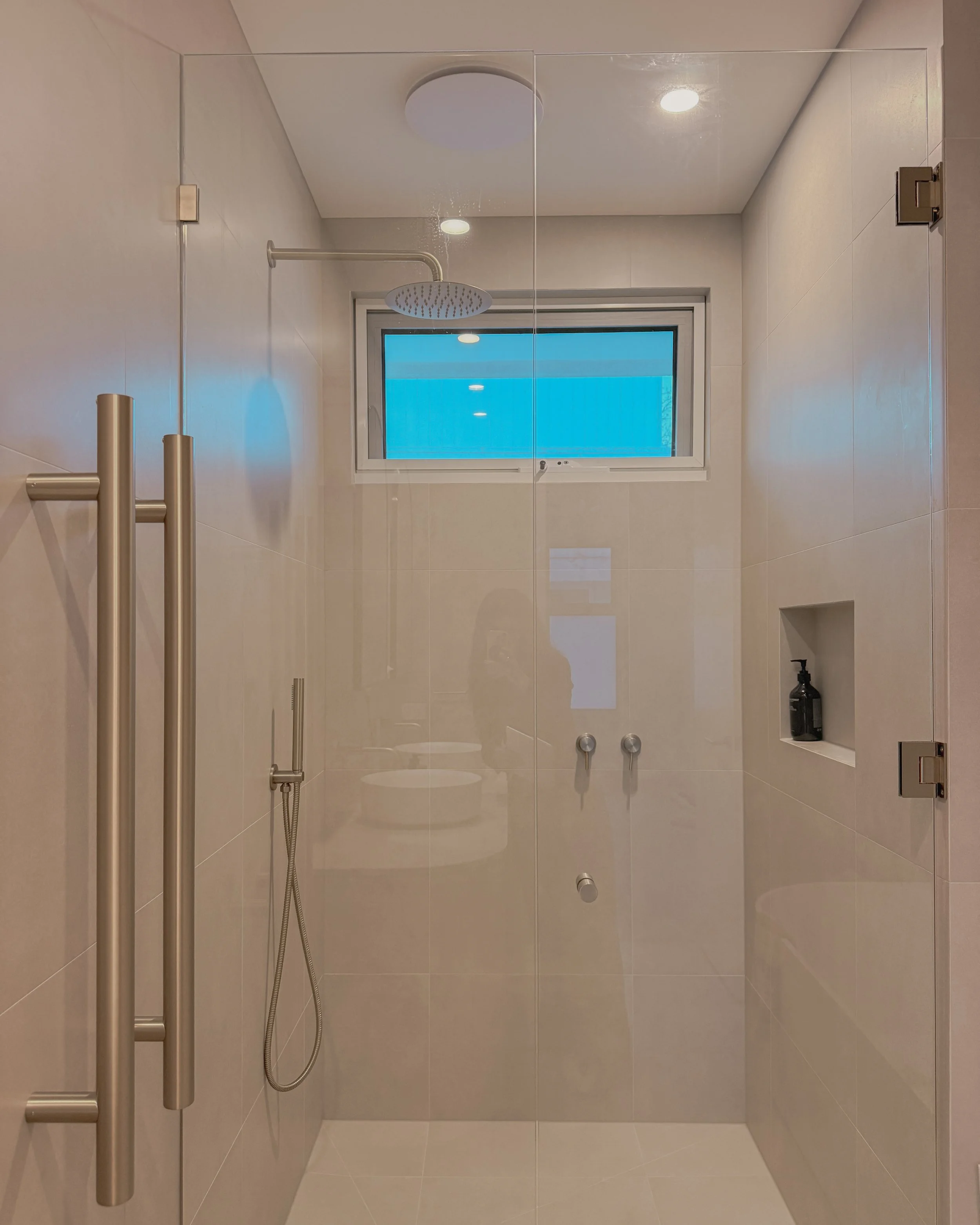 Contemporary bathroom with double vanity, enclosed shower and bathtub in Melbourne new-build. Designed by TID Studio, interior design in Sydney