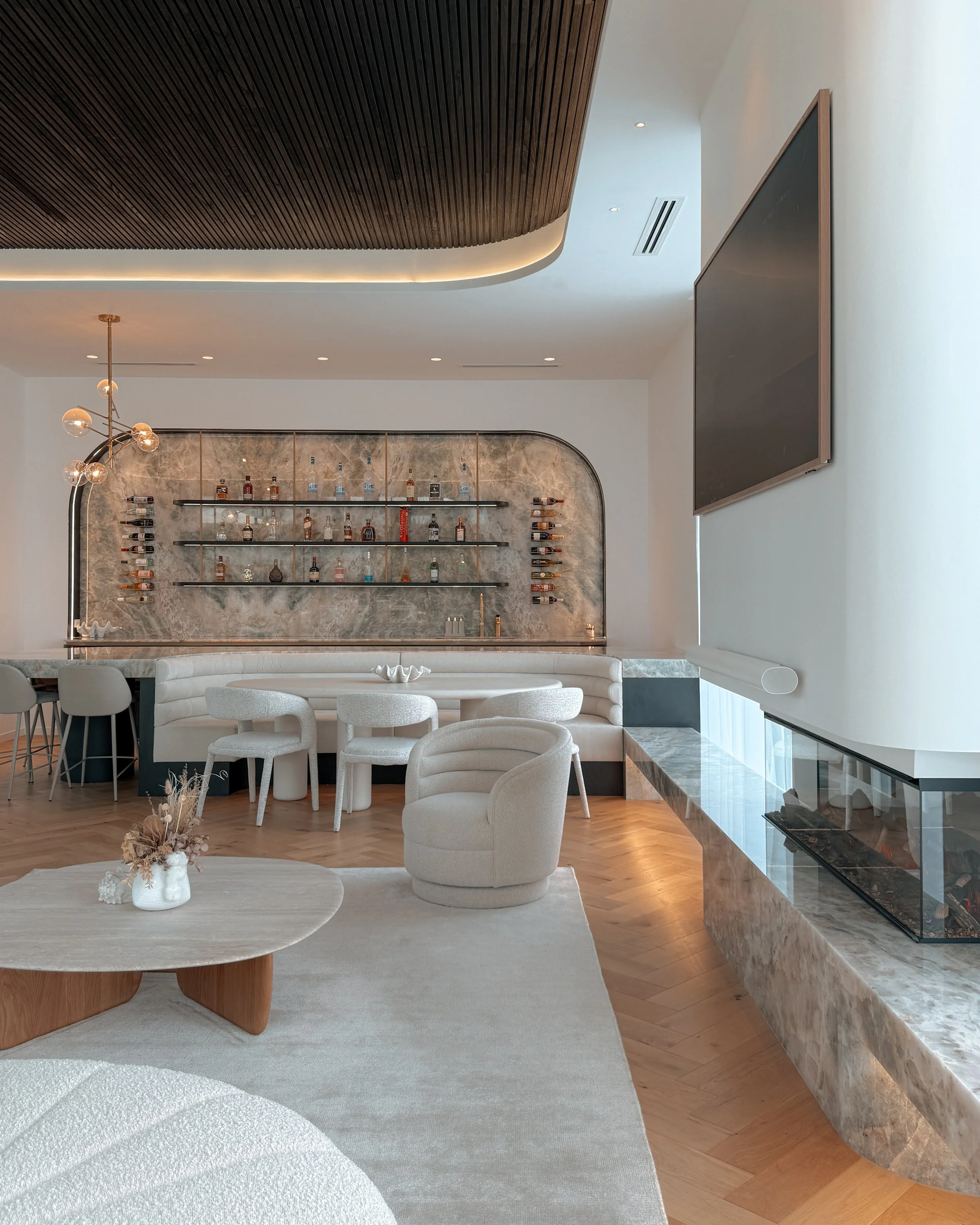 Modern coastal bar with island booth seating in a pool house in Brisbane, designed by TID Studio Sydney