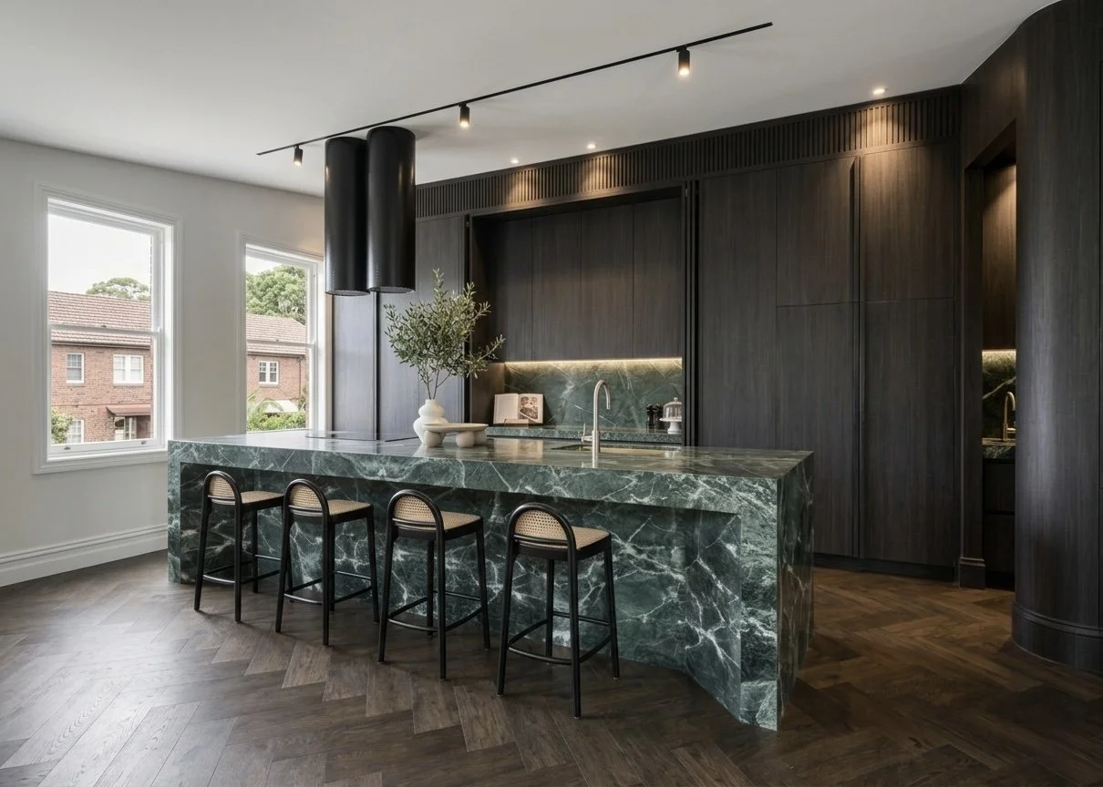 Full kitchen view showing dark joinery, green marble island, and sculptural lighting in Sydney terrace