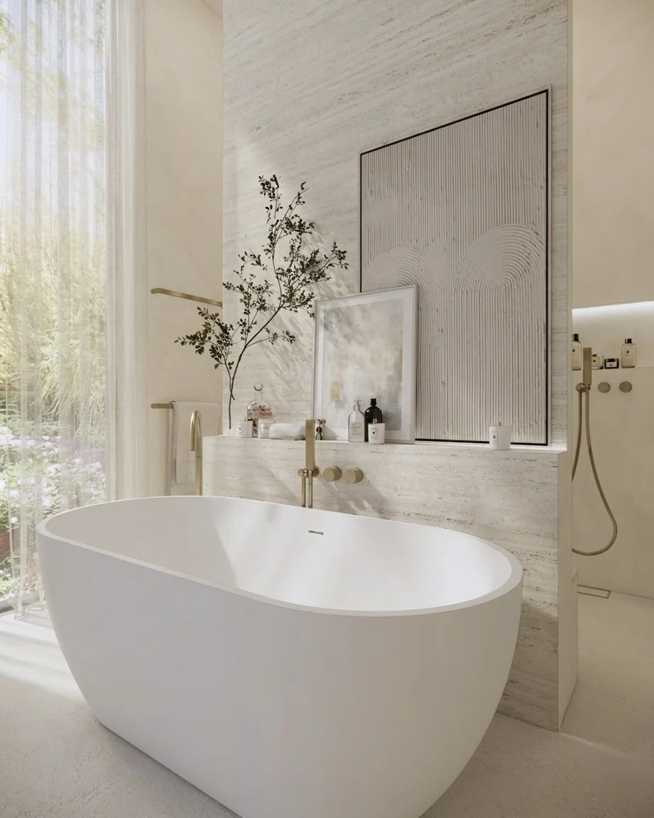 Serene Sands bathroom featuring curved rendered walls, travertine wall panel and central freestanding bath