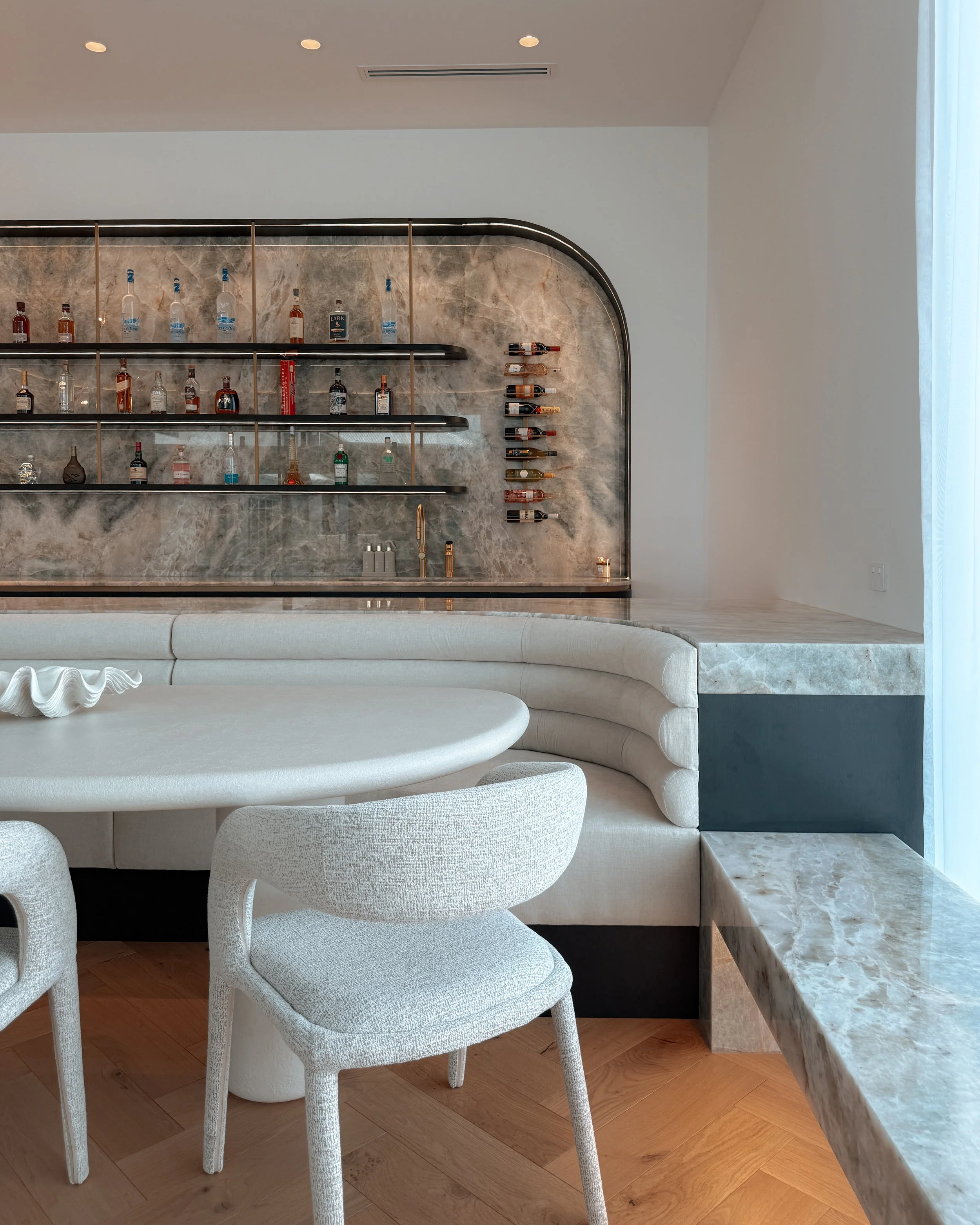 Modern coastal bar with island booth seating in a pool house in Brisbane, designed by TID Studio Sydney