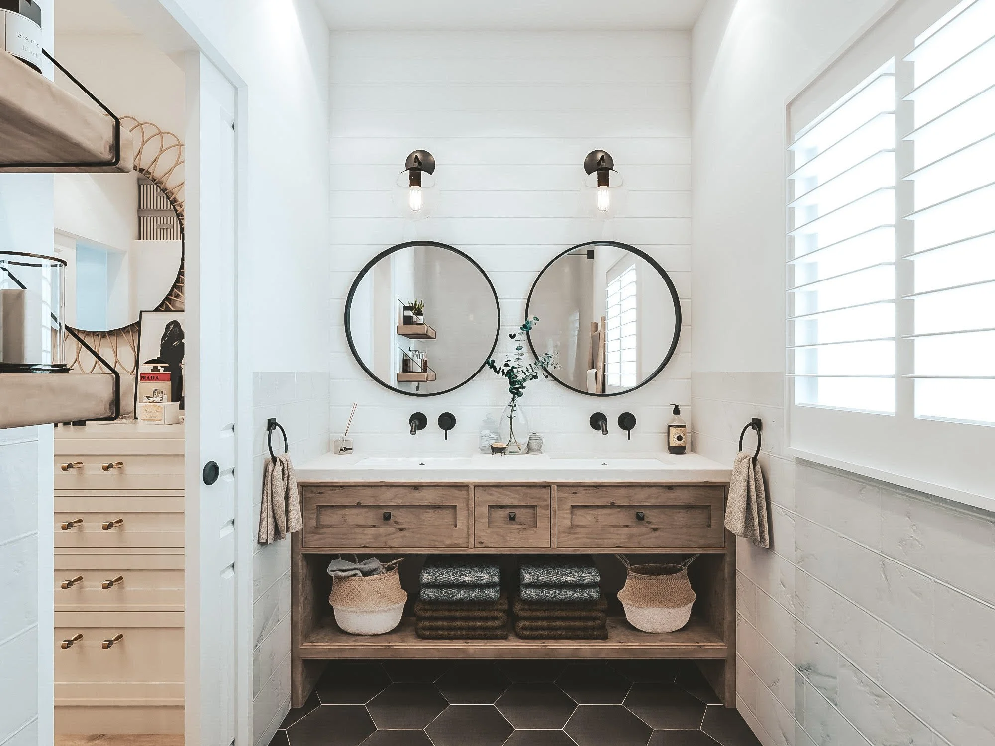 Soft coastal bathroom with freestanding tub and patterned tiles in a Hamptons-style design