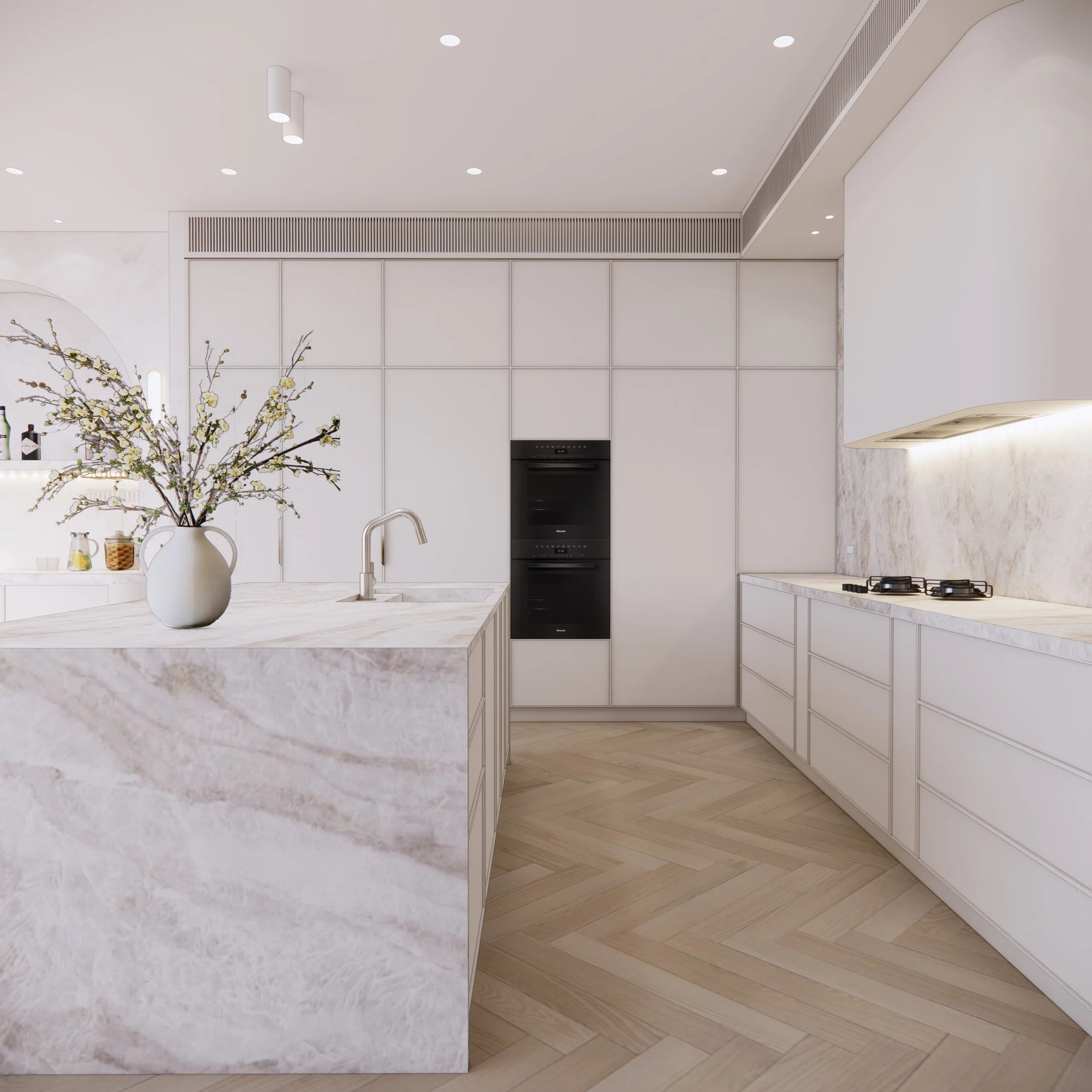 Softly textured kitchen interior with natural stone, neutral cabinetry, and ambient lighting