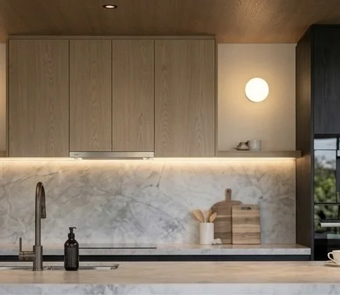 Modern black-and-oak kitchen design with stone island and timber ceiling feature — Brisbane interior design