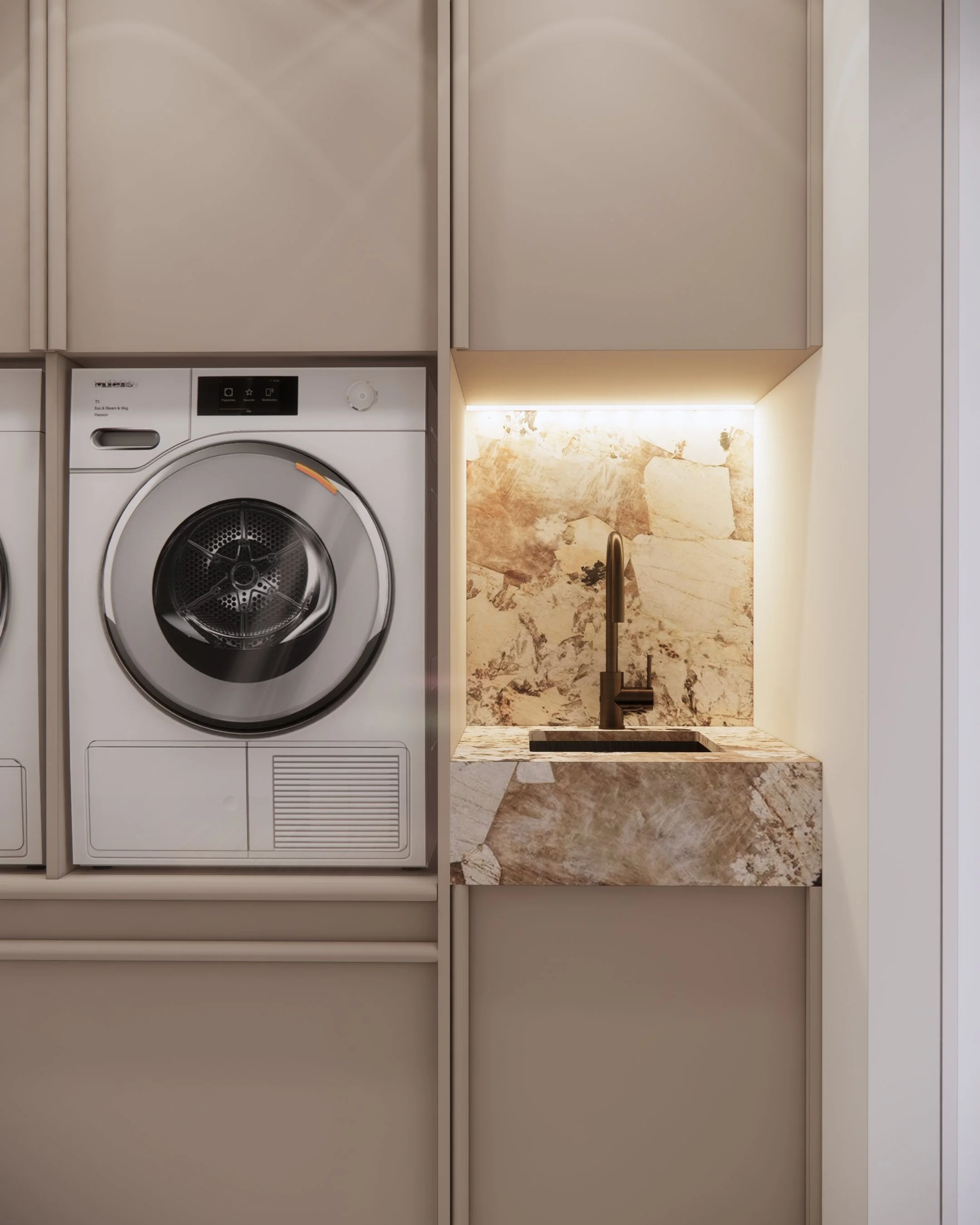 Modern laundry with integrated appliances and warm beige cabinetry