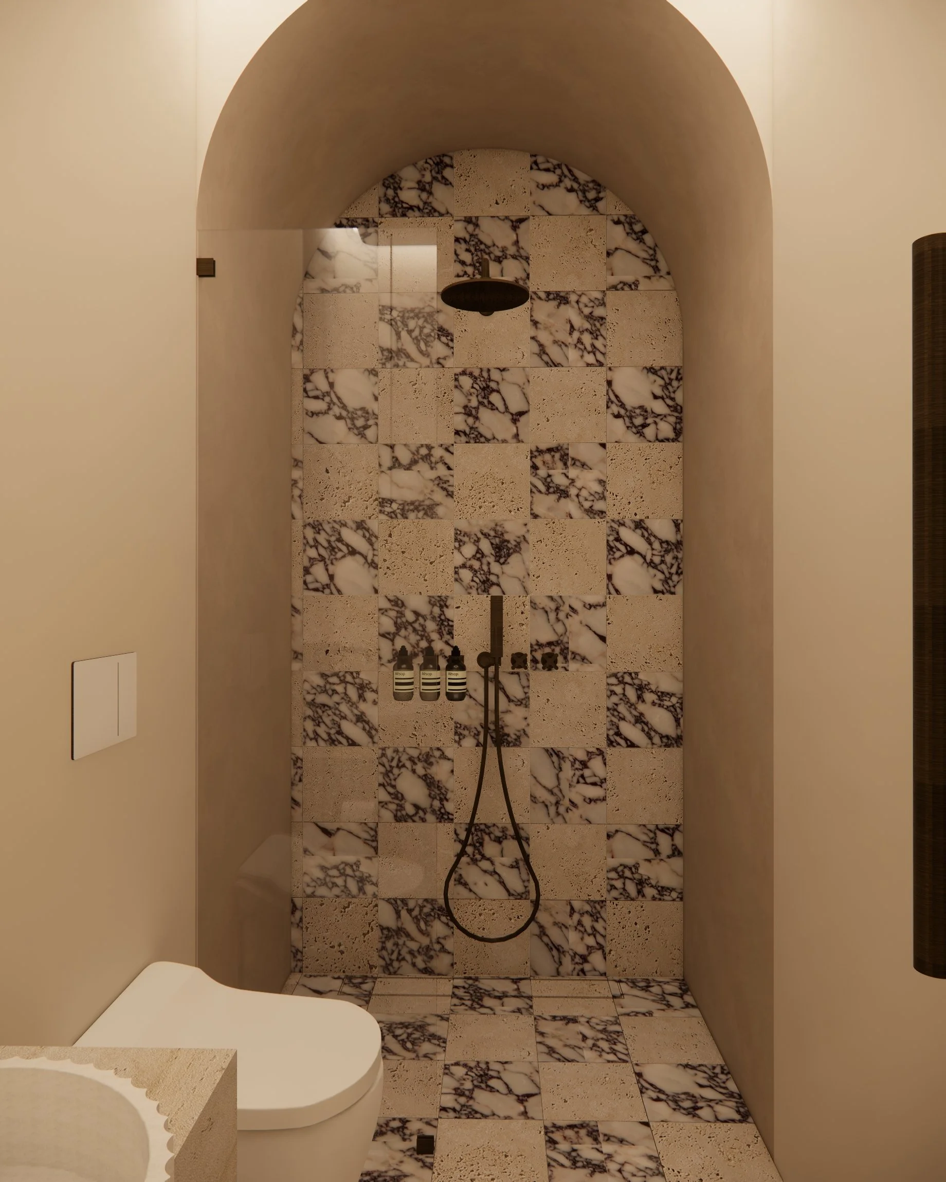 Arched shower entry and patterned marble tiles in a sculptural powder room designed by TID Studio