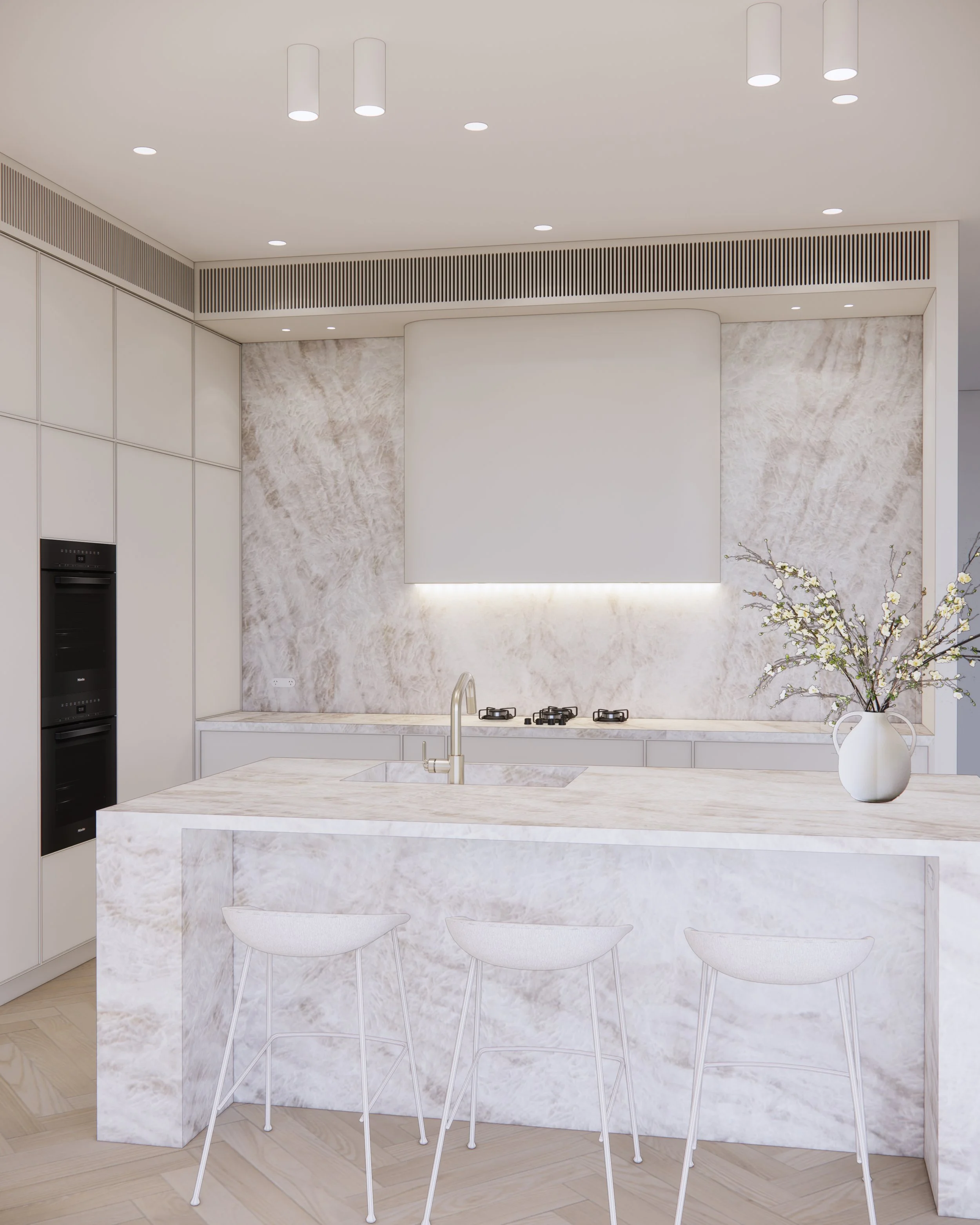 Softly textured kitchen interior with natural stone, neutral cabinetry, and ambient lighting