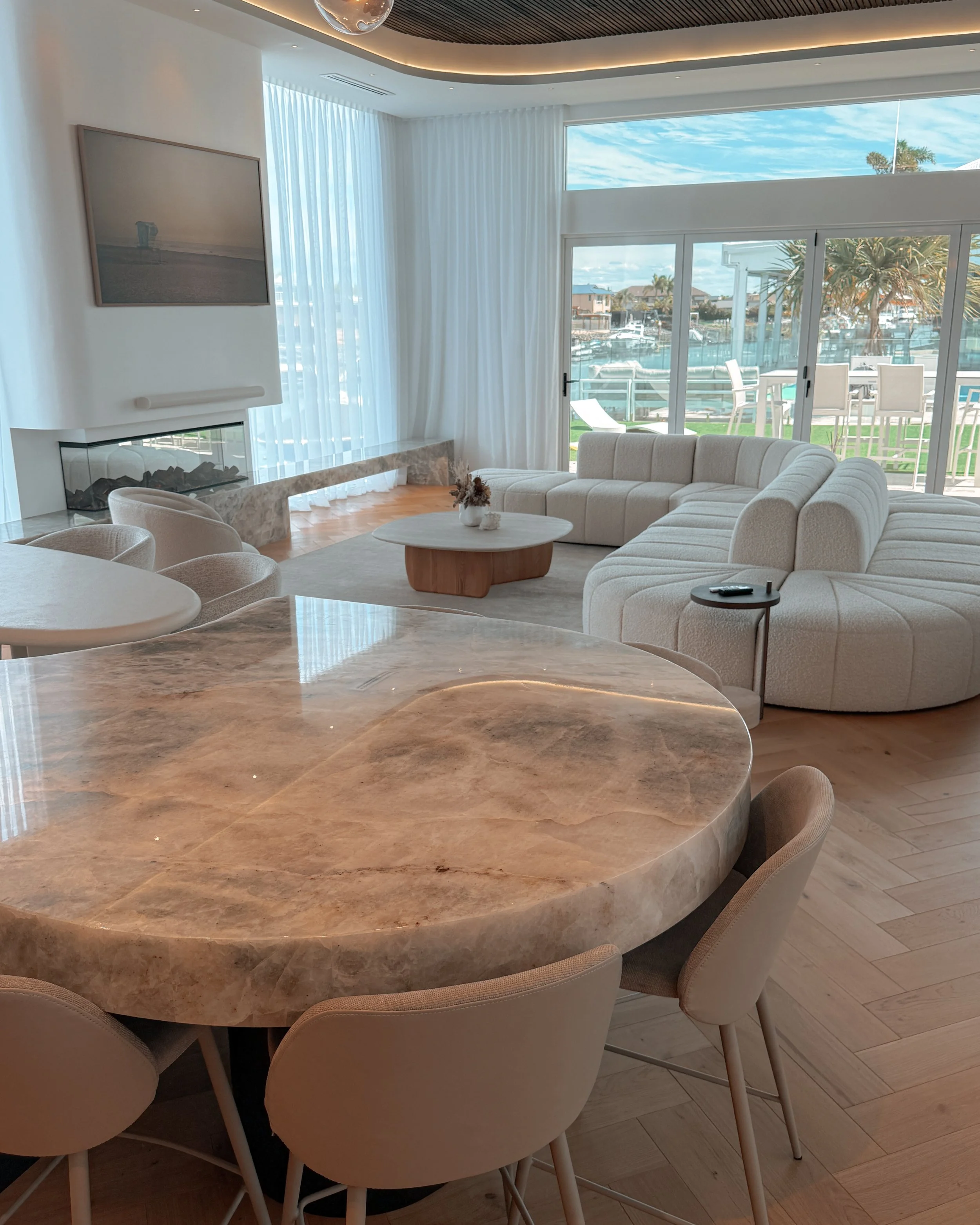 Modern coastal bar with island booth seating in a pool house in Brisbane, designed by TID Studio Sydney