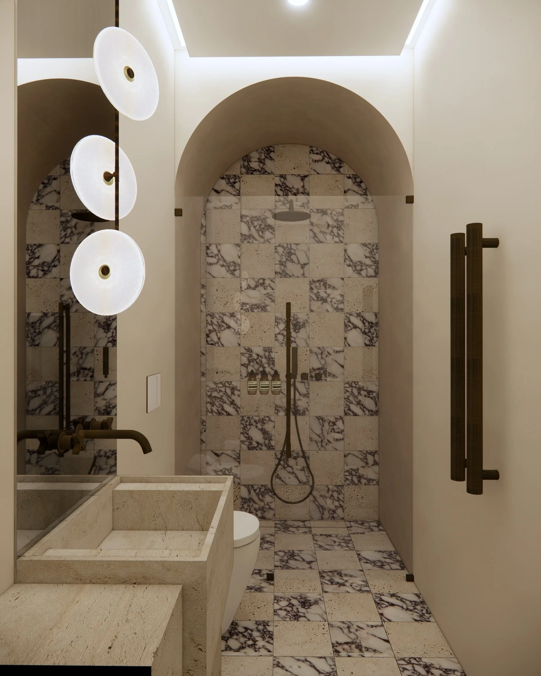 Arched shower entry and patterned marble tiles in a sculptural powder room designed by TID Studio