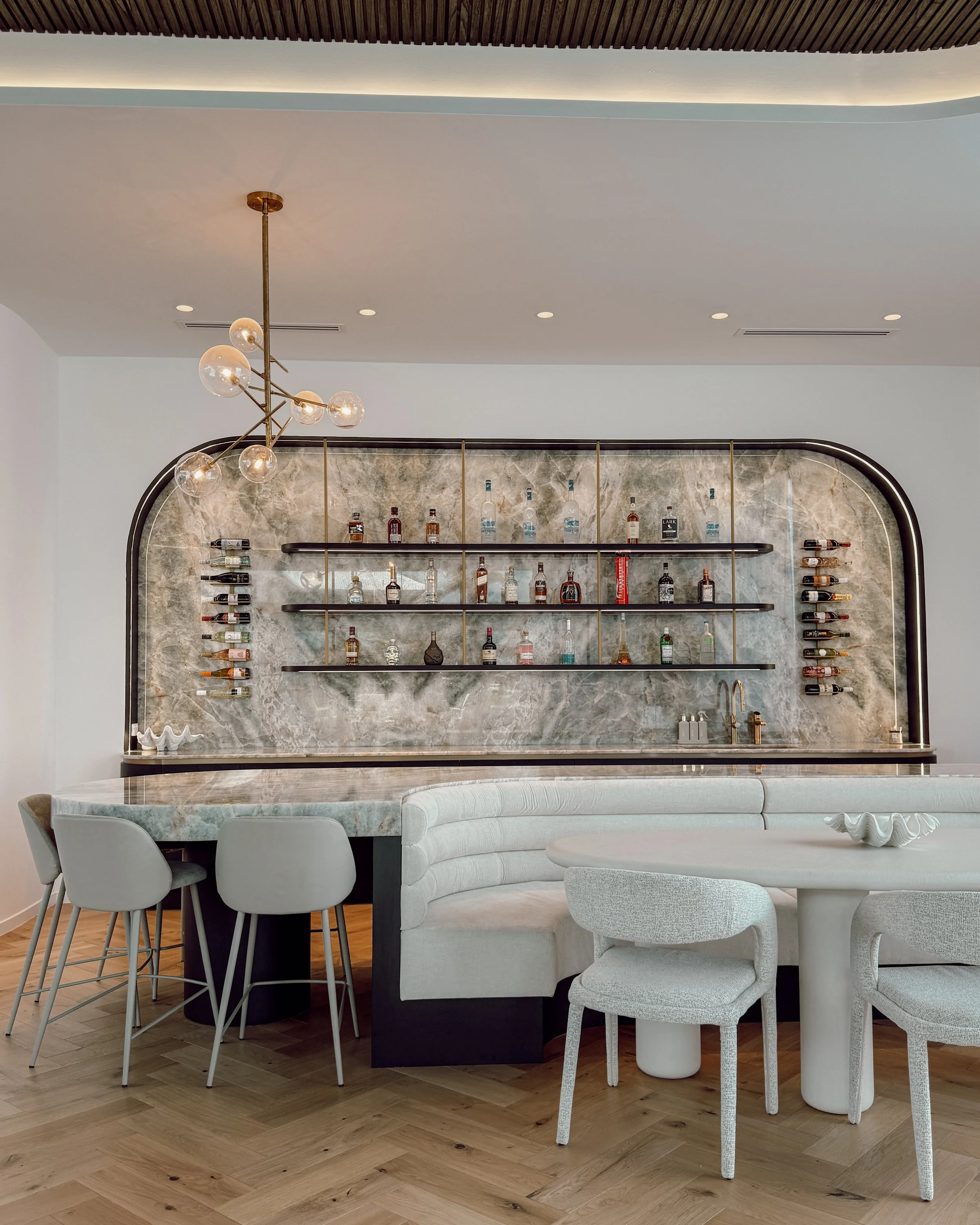 Modern coastal bar with island booth seating in a pool house in Brisbane, designed by TID Studio Sydney