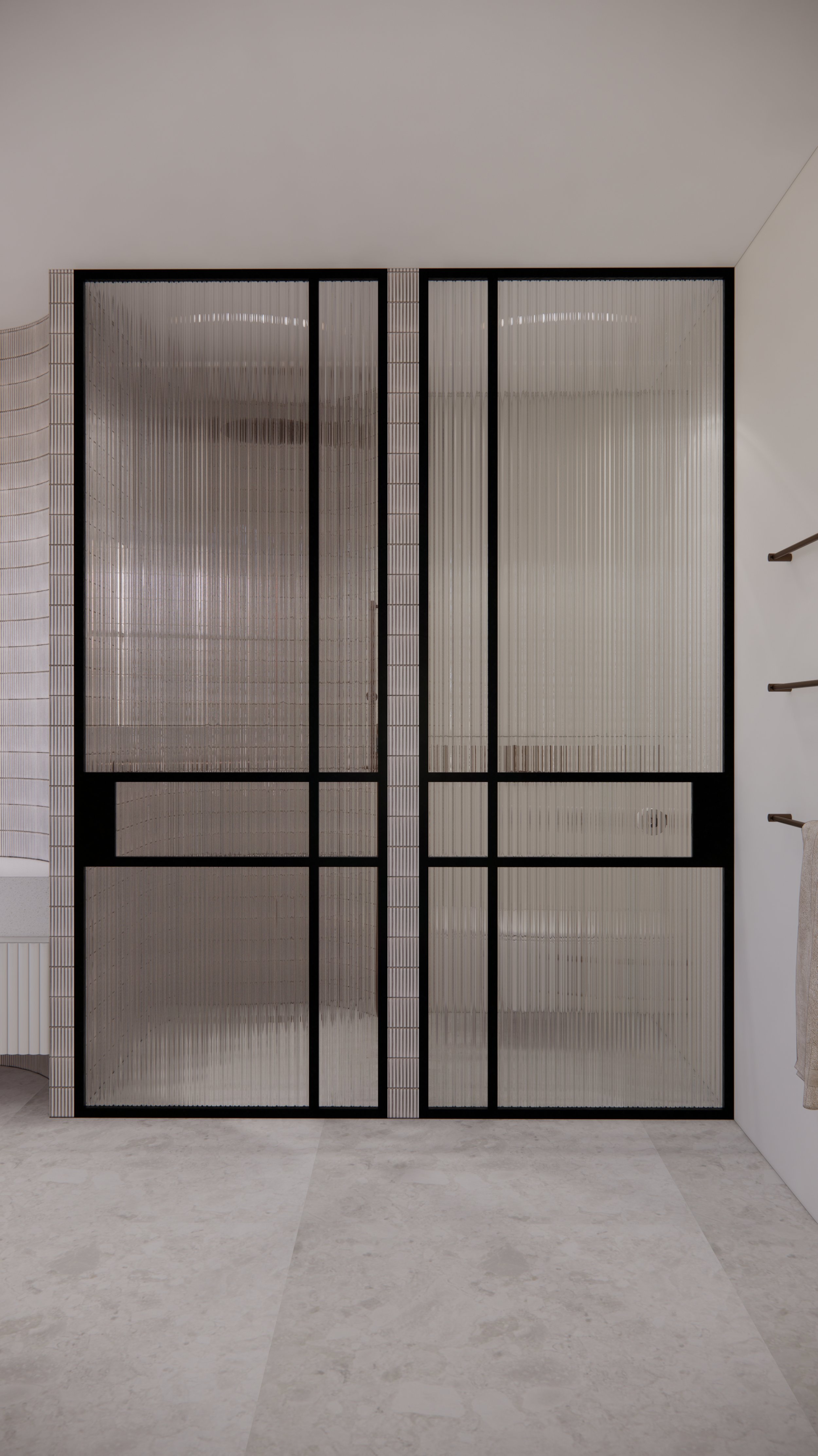 Modern coastal bathroom with curved tiled shower wall and brushed brass and Fluted glass shower screen fixtures designed by TID Studio in Brisbane
