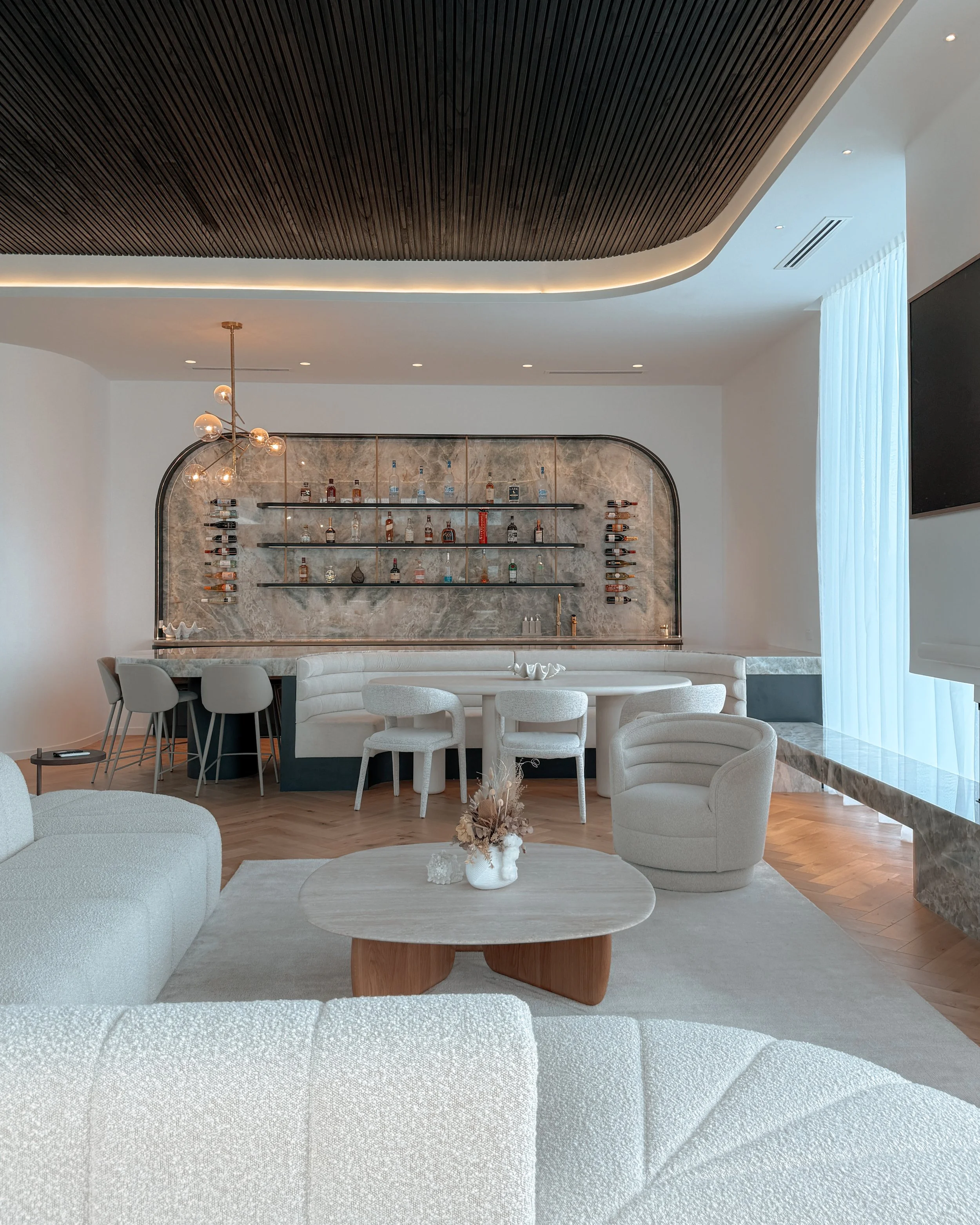 Modern coastal bar with island booth seating in a pool house in Brisbane, designed by TID Studio Sydney