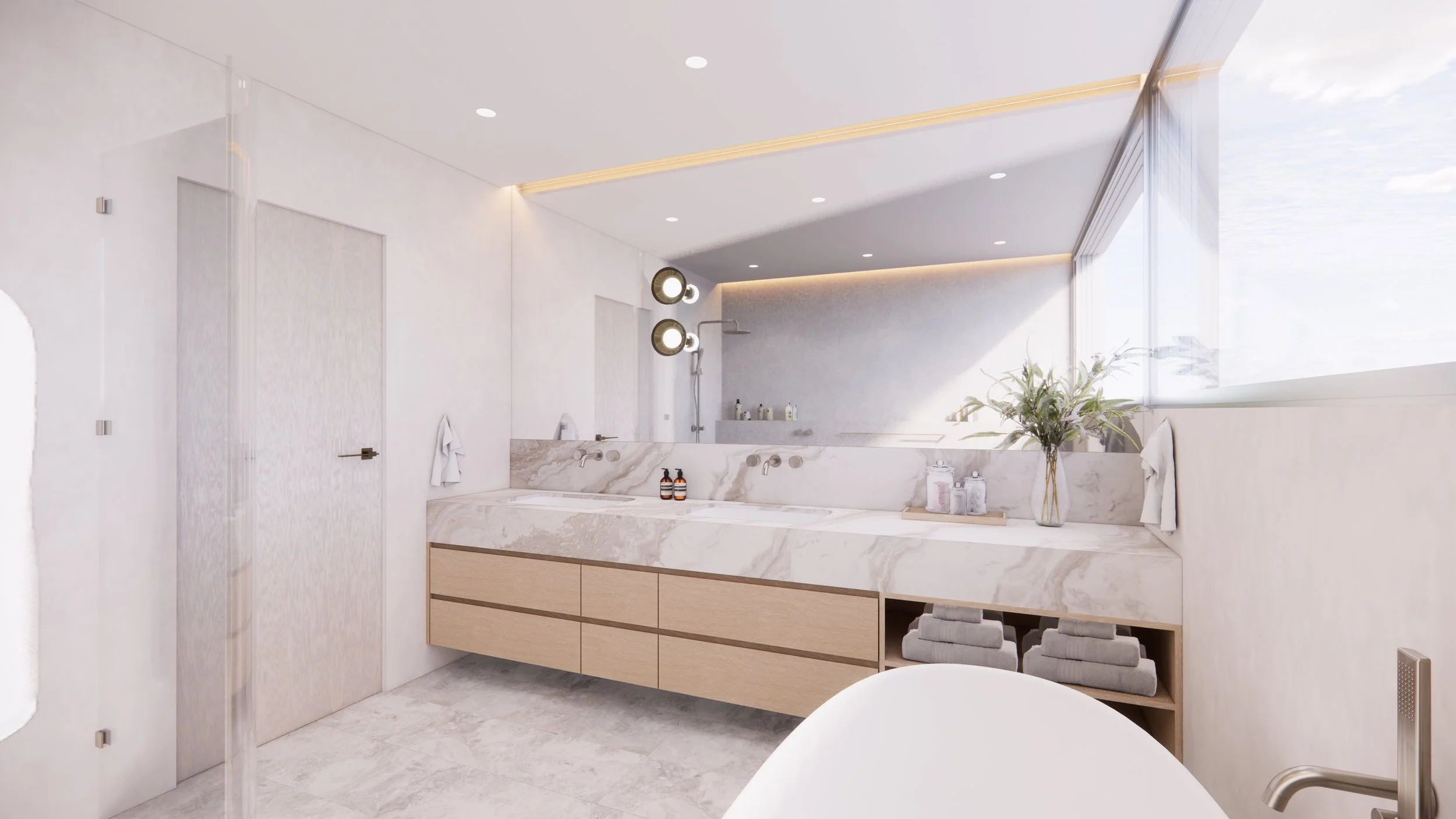 A serene, modern bathroom with marble surfaces and soft timber detailing, part of TID Studio’s Sydney renovation