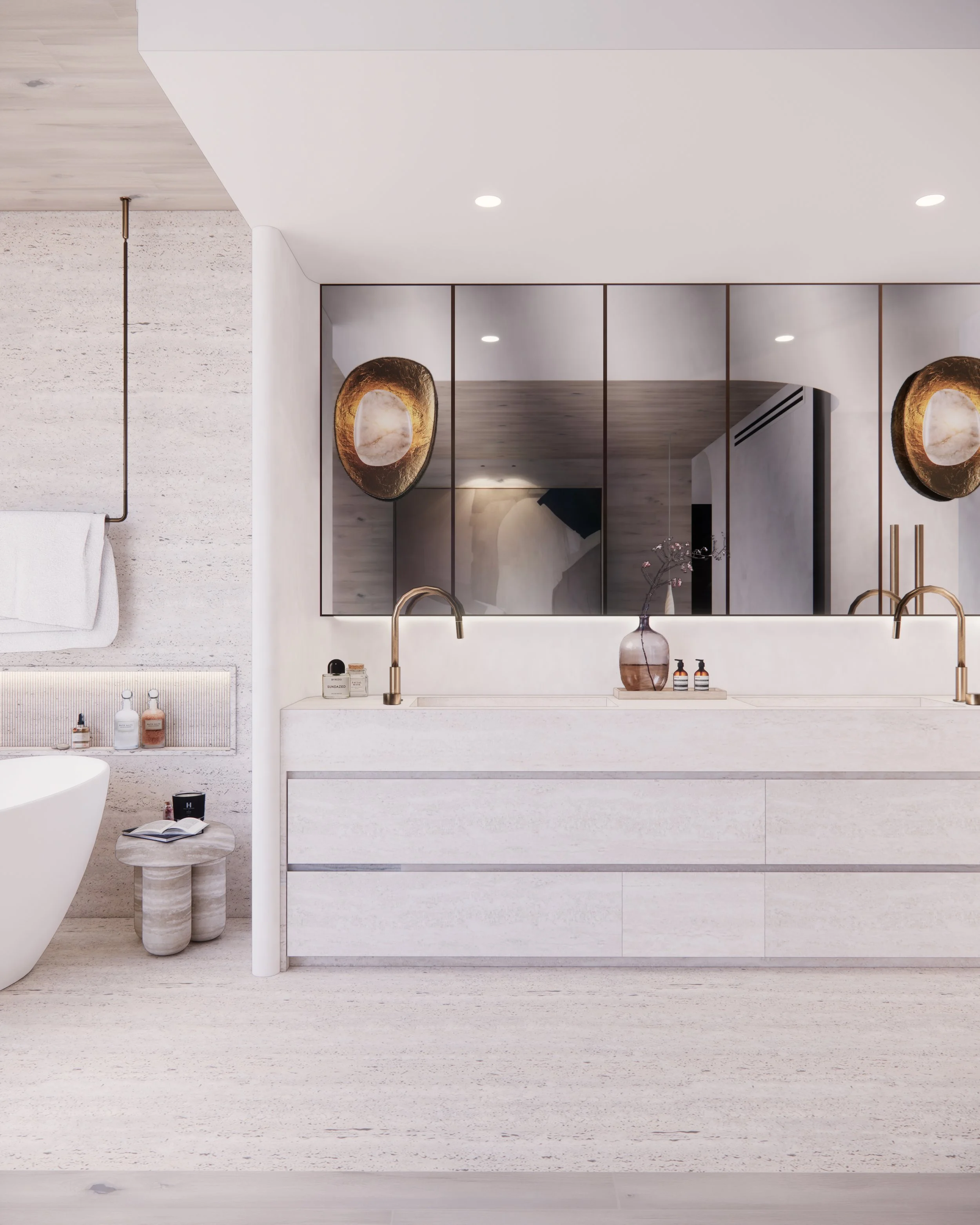 Sculptural double vanity in bold veined marble with curved detailing and brass tapware