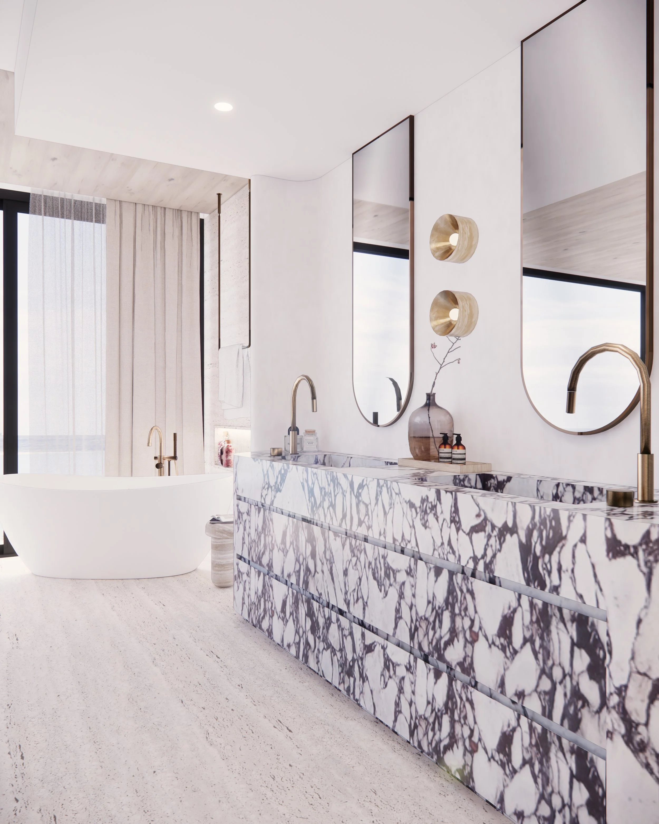 Sculptural double vanity in bold veined marble with curved detailing and brass tapware