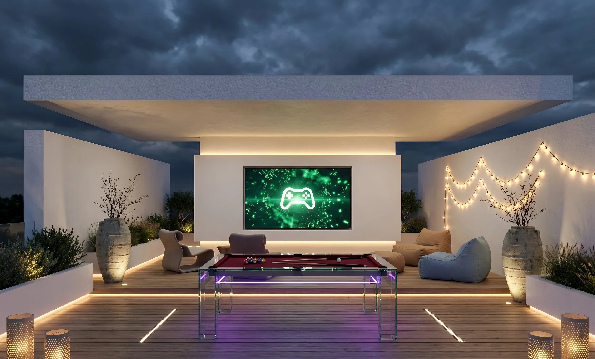 Modern outdoor rooftop lounge with a pool table, bean bags, potted plants, string lights, and a large screen displaying a green gaming controller icon, under a cloudy evening sky.