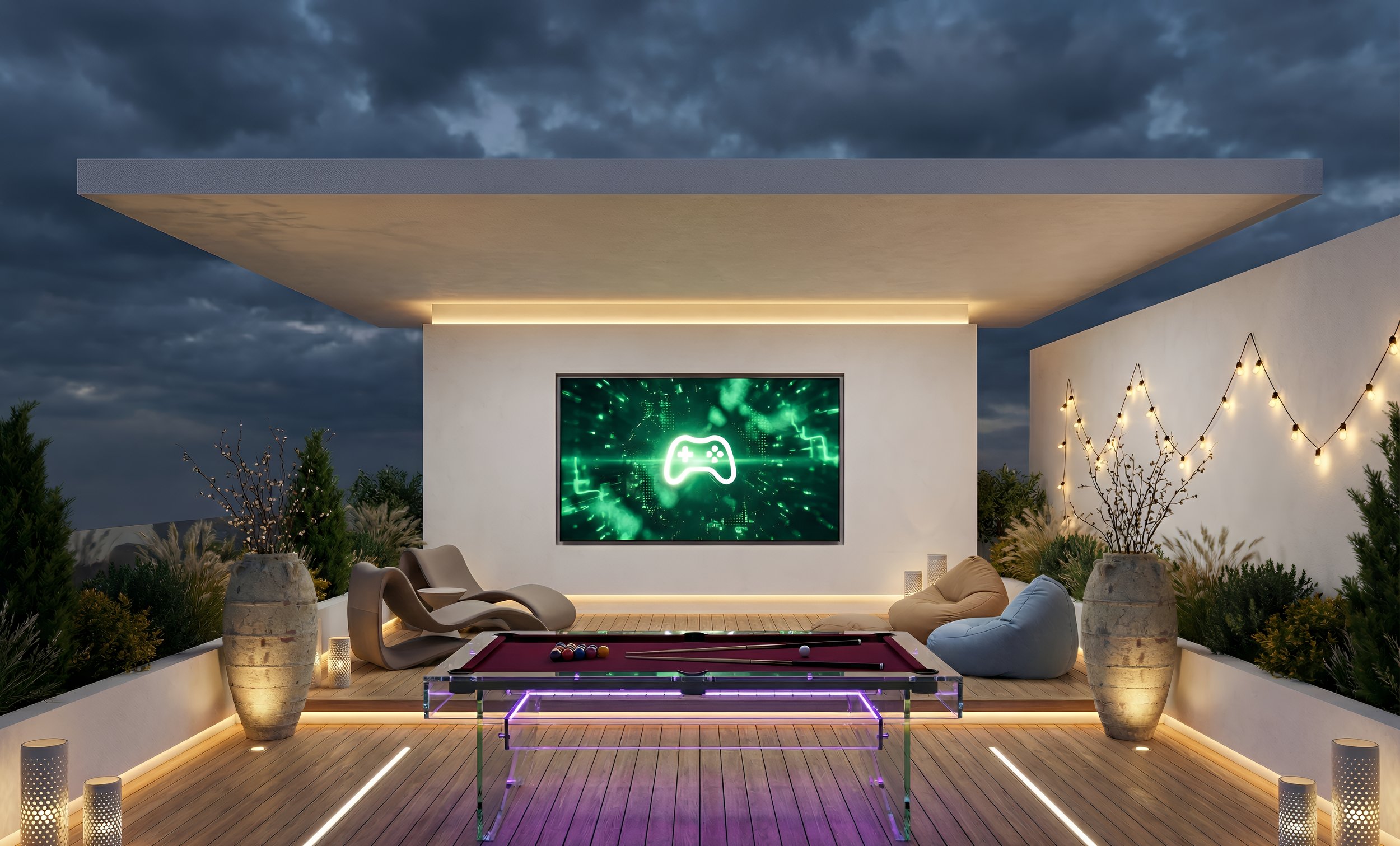 Modern outdoor rooftop lounge area with a pool table, bean bags, shaped chairs, large vases with plants, string lights, and a large LED screen displaying a gaming icon against a dark, cloudy sky.