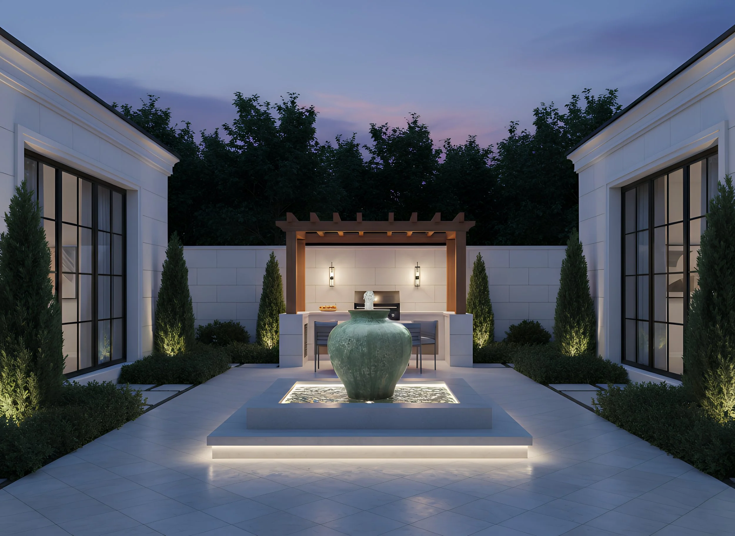 An outdoor modern patio area with a water fountain in the center, surrounded by greenery and seating, illuminated by soft lighting at dusk.