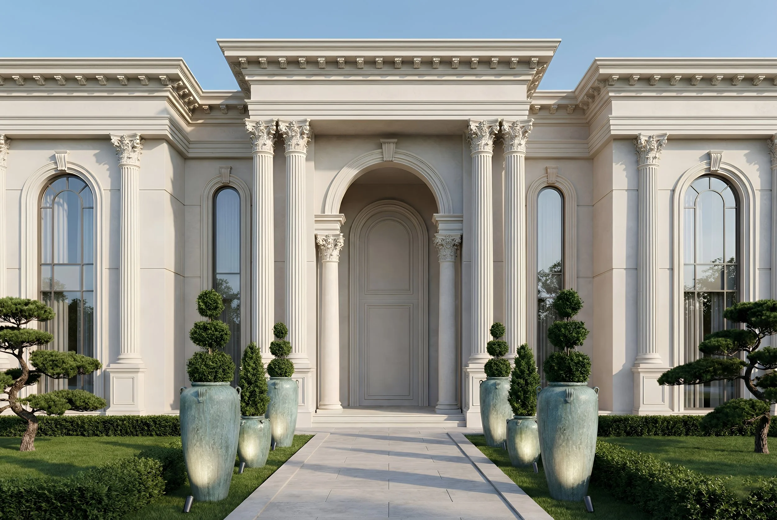 Front view of a grand, white neoclassical mansion with tall columns, arched windows, and manicured landscaping.