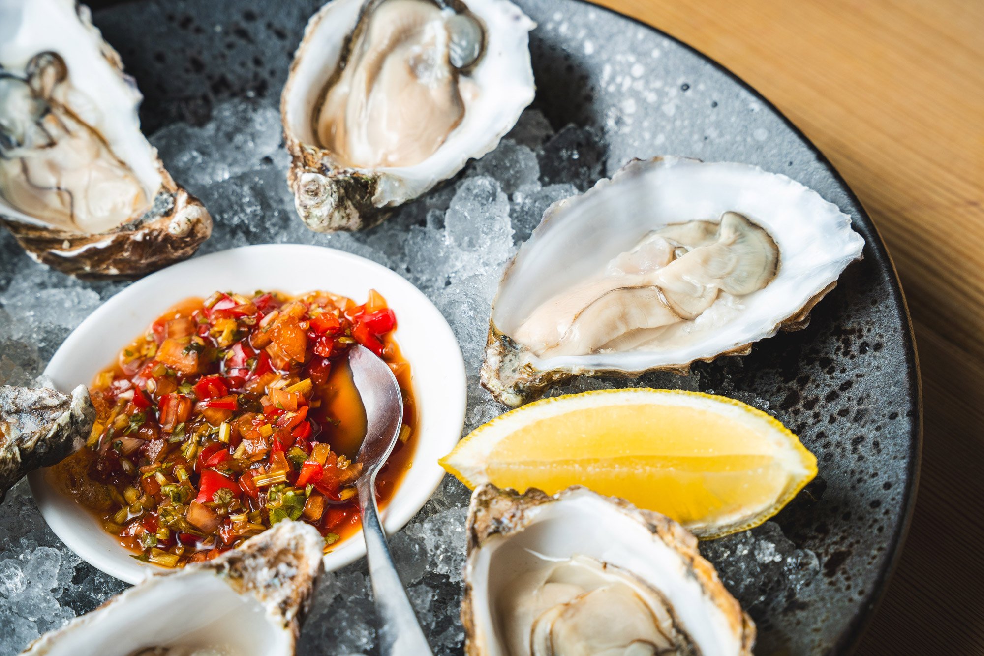 Fresh oysters on the half shell served on ice with lemon and chilli dressing at The Bay Horse Market Weighton.