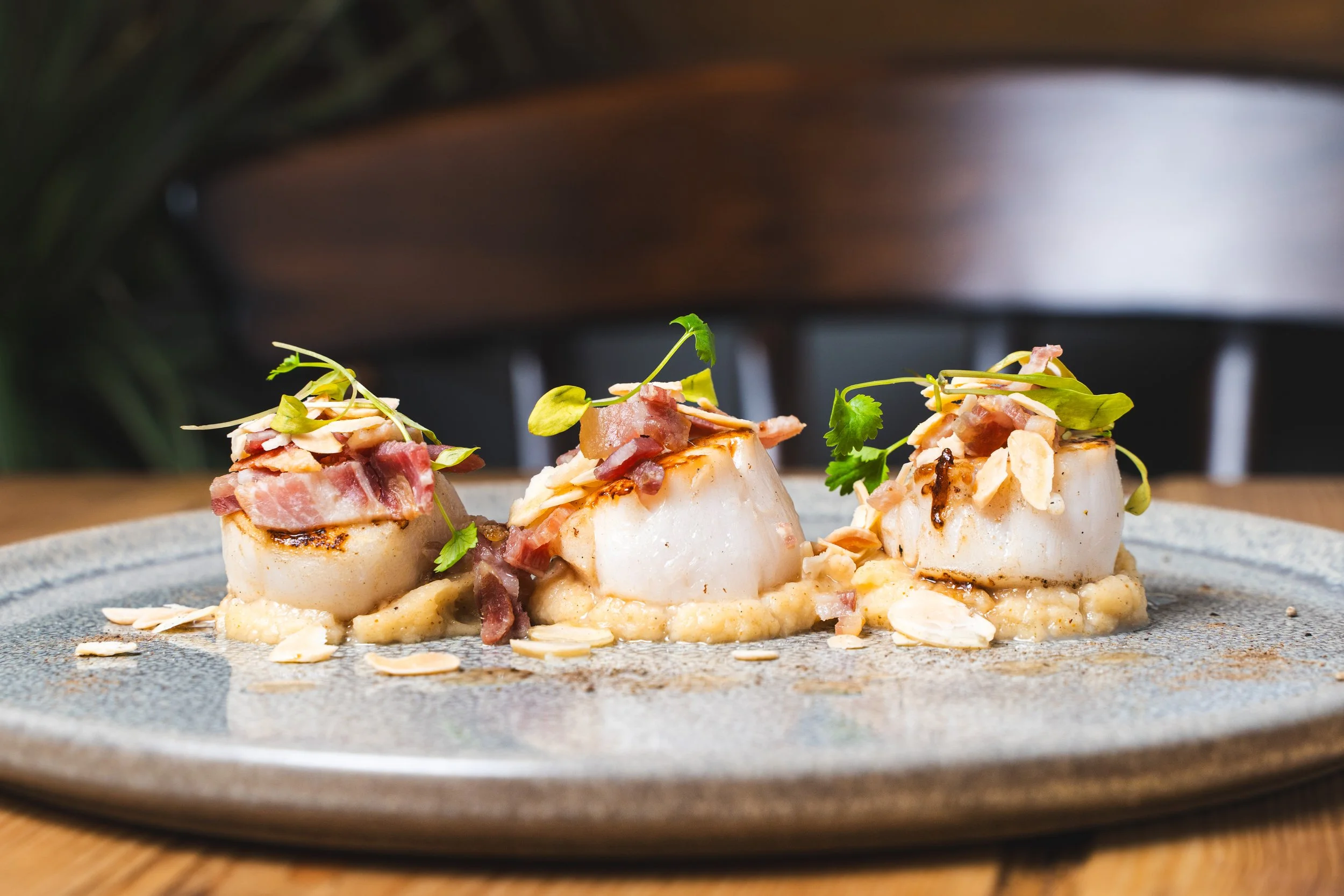 Seafood starter of pan-seared scallops with bacon and almonds at The Bay Horse, Market Weighton.