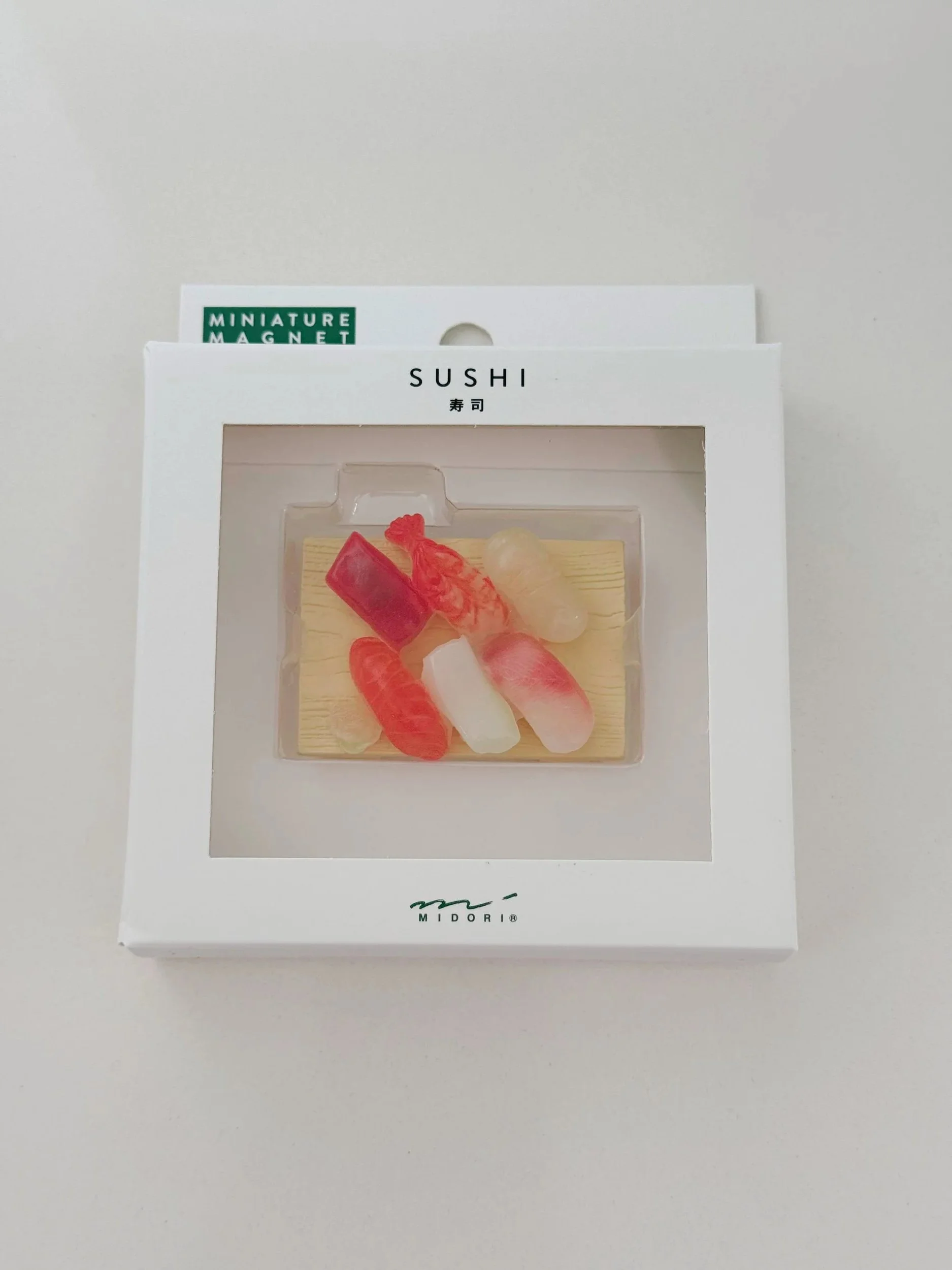 Iman miniatura · Sushi