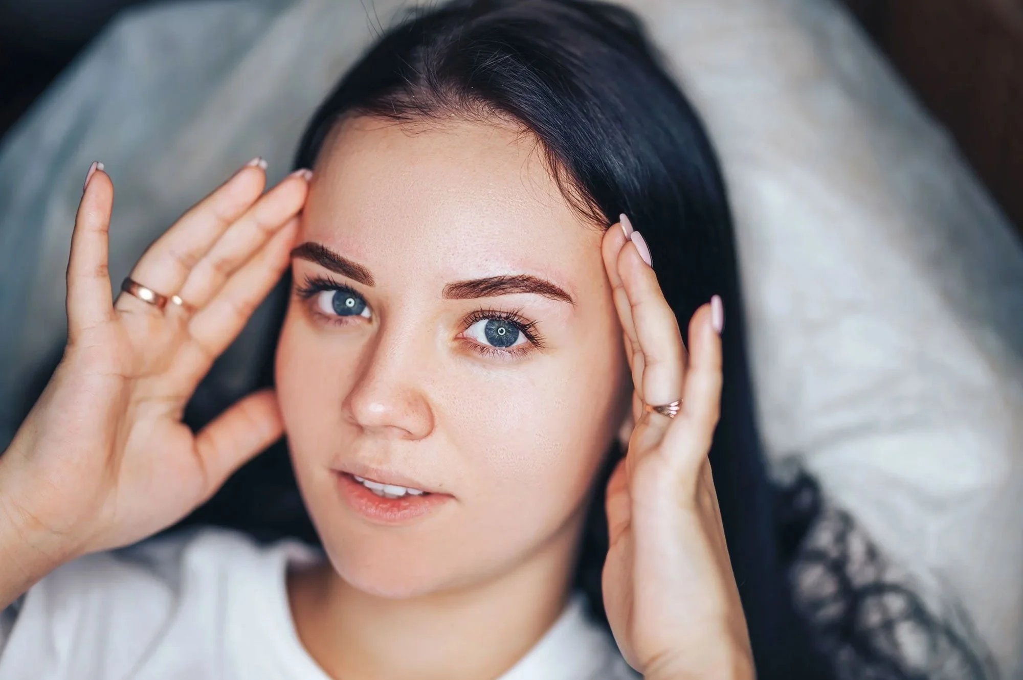 Woman with ombre brows after permanent makeup procedure 