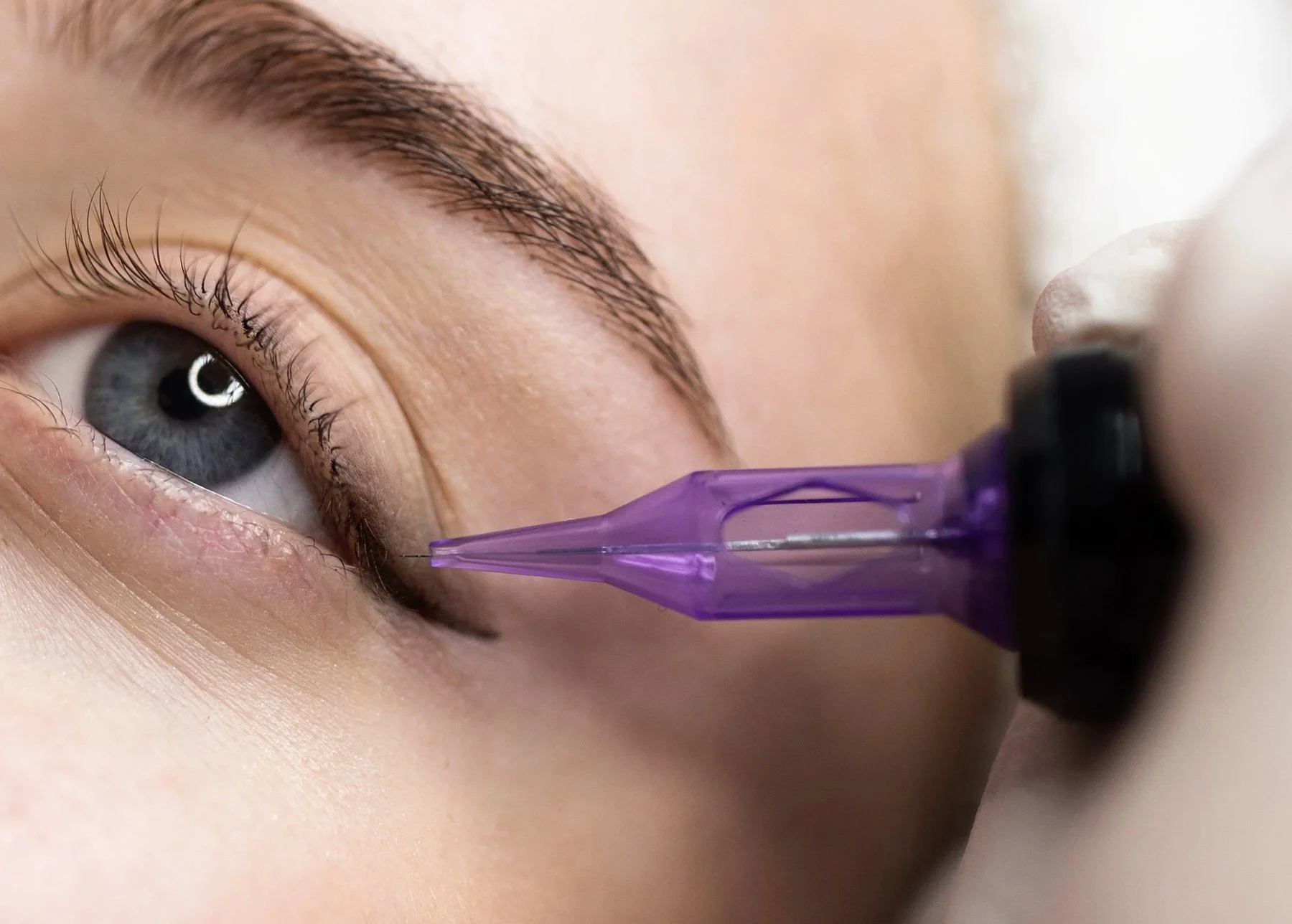Woman receiving permanent eyeliner treatment Staffordshire