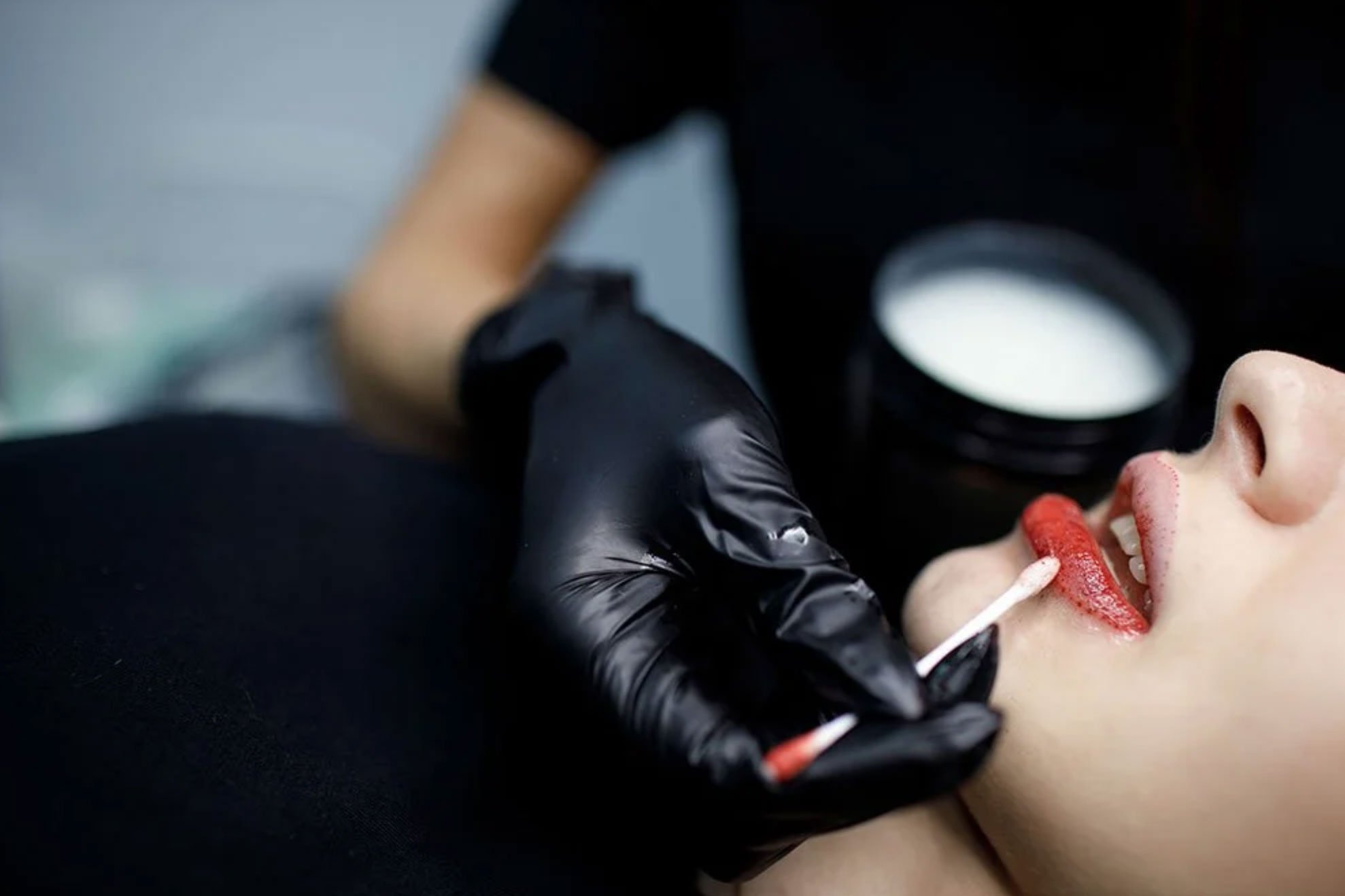 Woman receiving lip blush treatment at Stone clinic