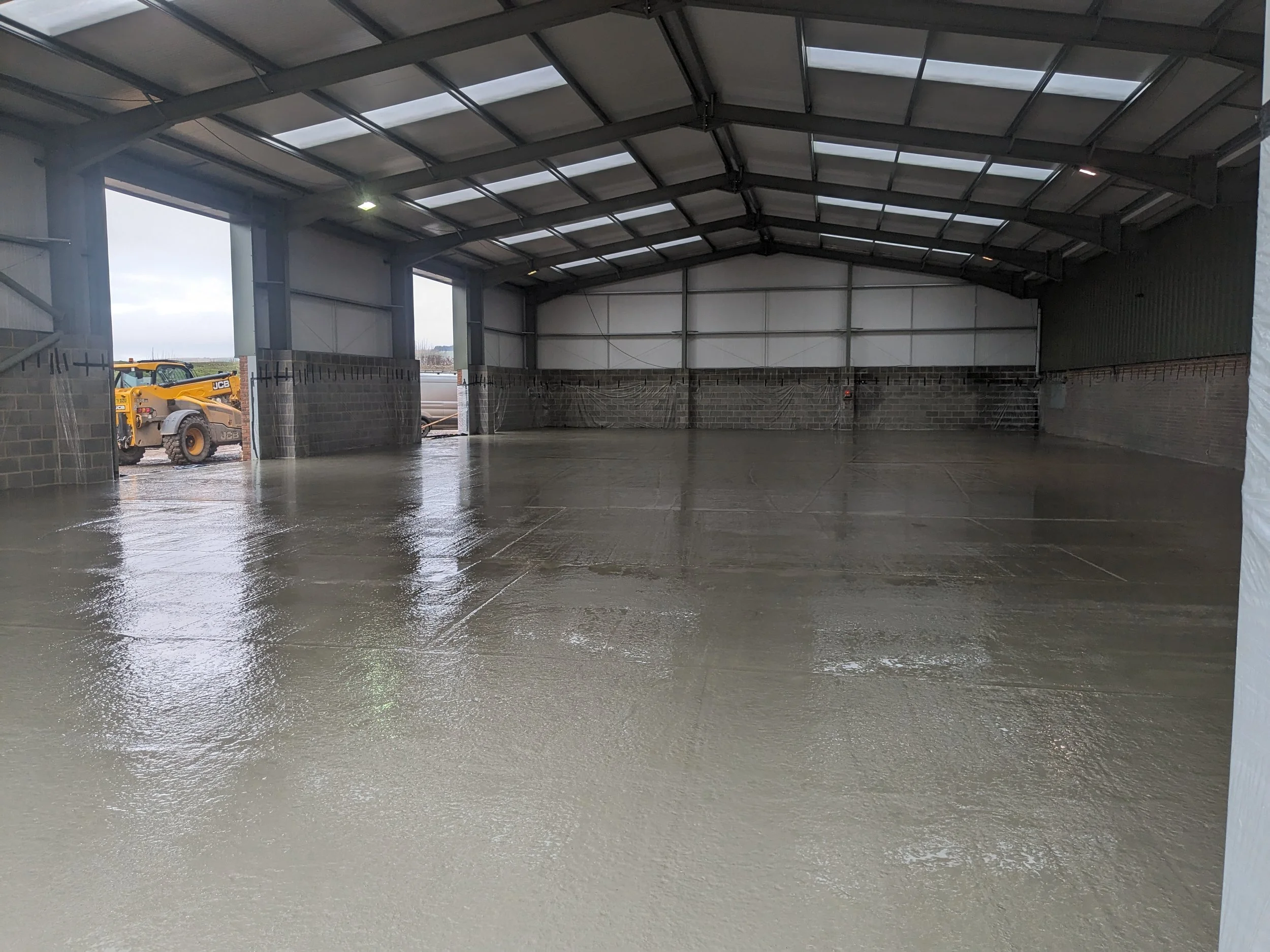 Concrete poured ready for power floating by our team