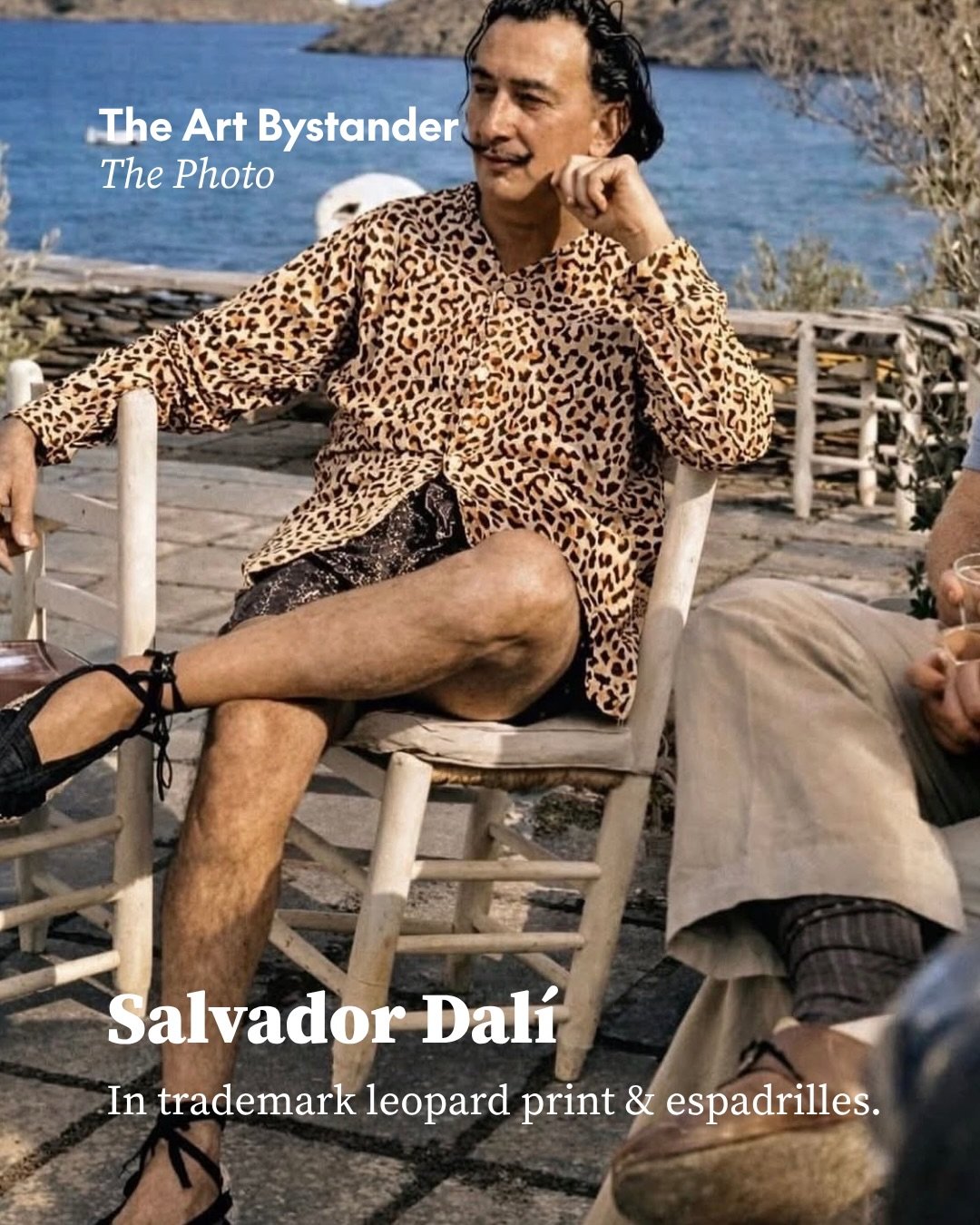 Salvador Dal&iacute; at home in Portlligat, dressed in a leopard-print shirt, swimming shorts and traditional Catalan espadrilles tied around the ankles. It is a wonderfully relaxed image of an artist usually remembered in full performance, his moust