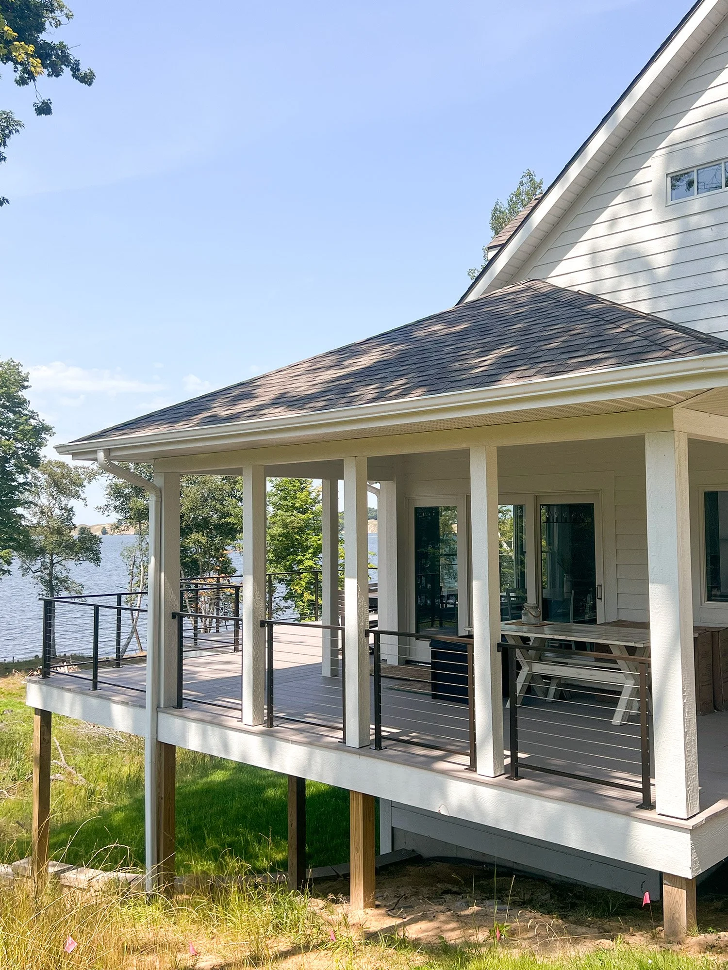 Beach house with wrap around porch and railing