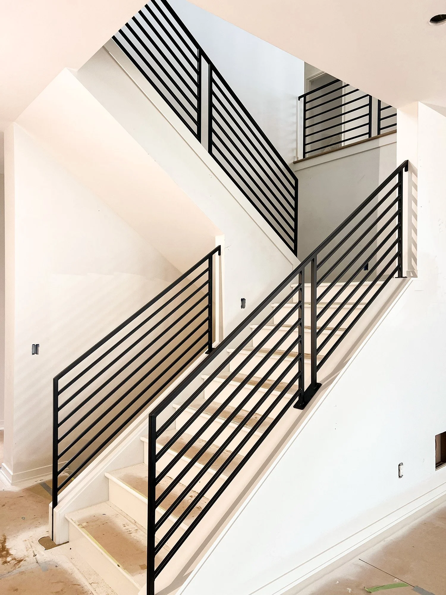 Iron Railing on white staircase