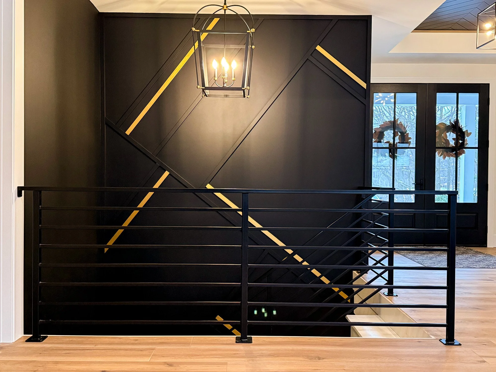 Black stairwell with iron railing