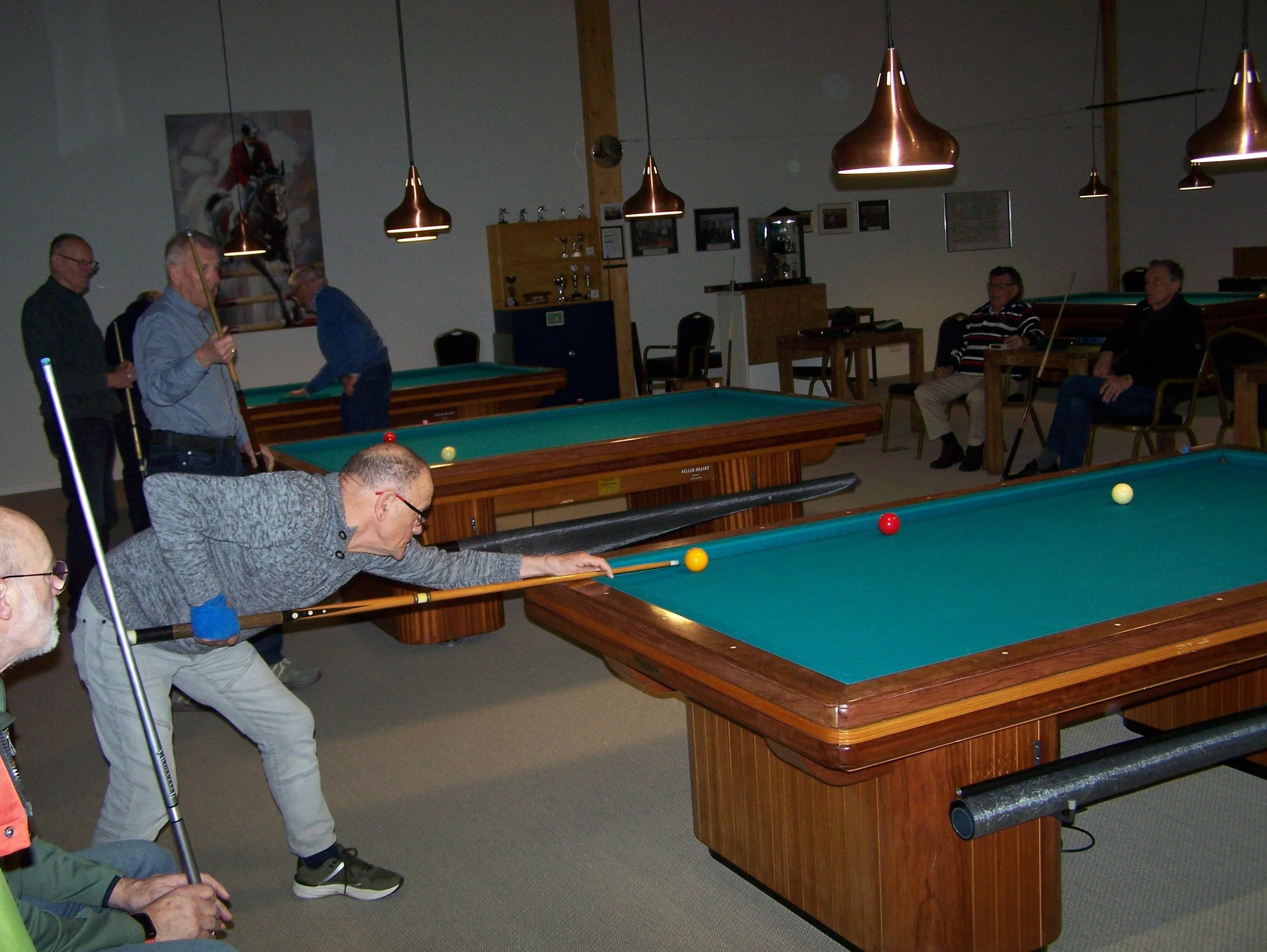 House with a porch, brick steps, and a garden with flowers.